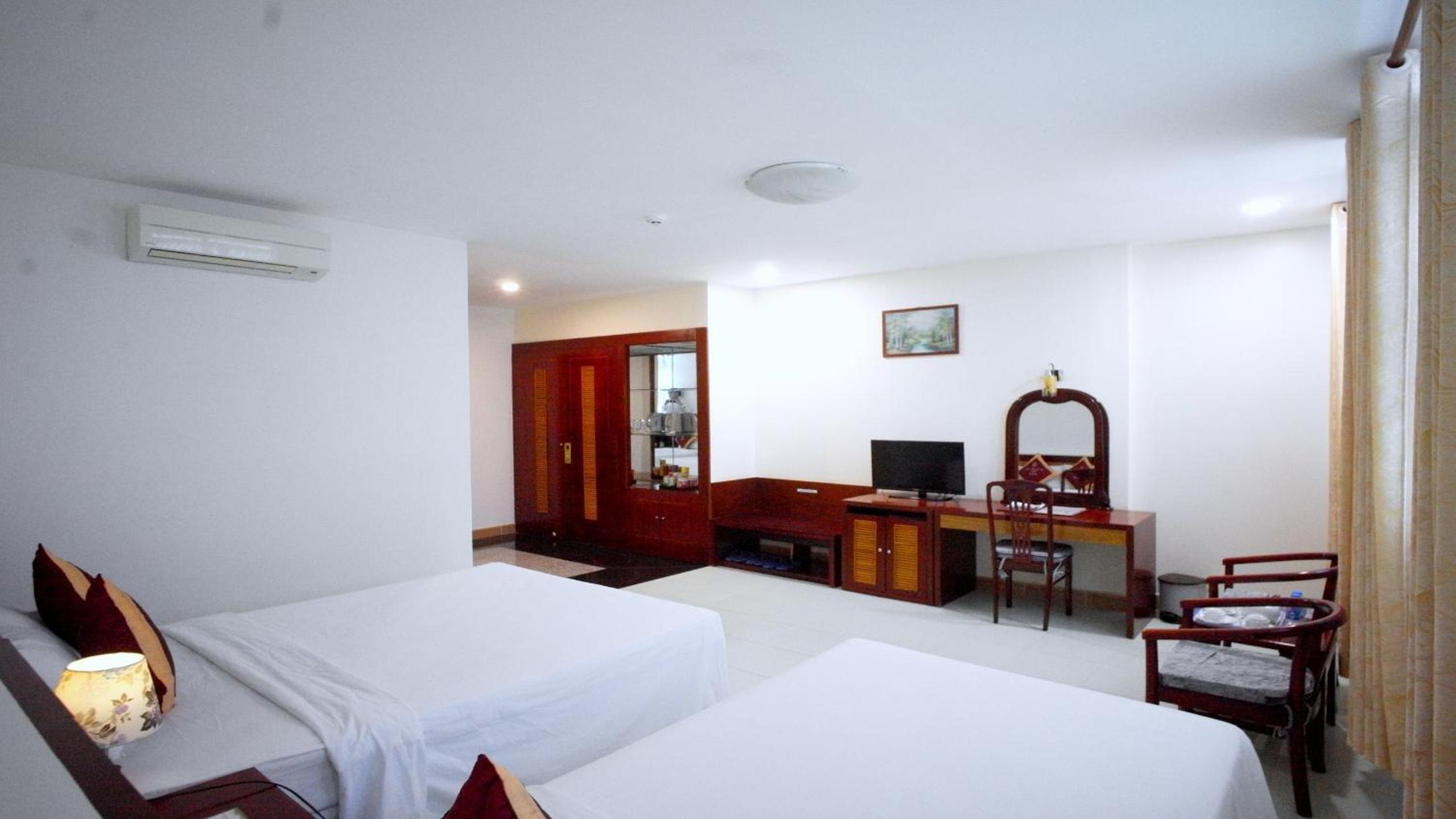Deluxe Triple Room - Photo 14