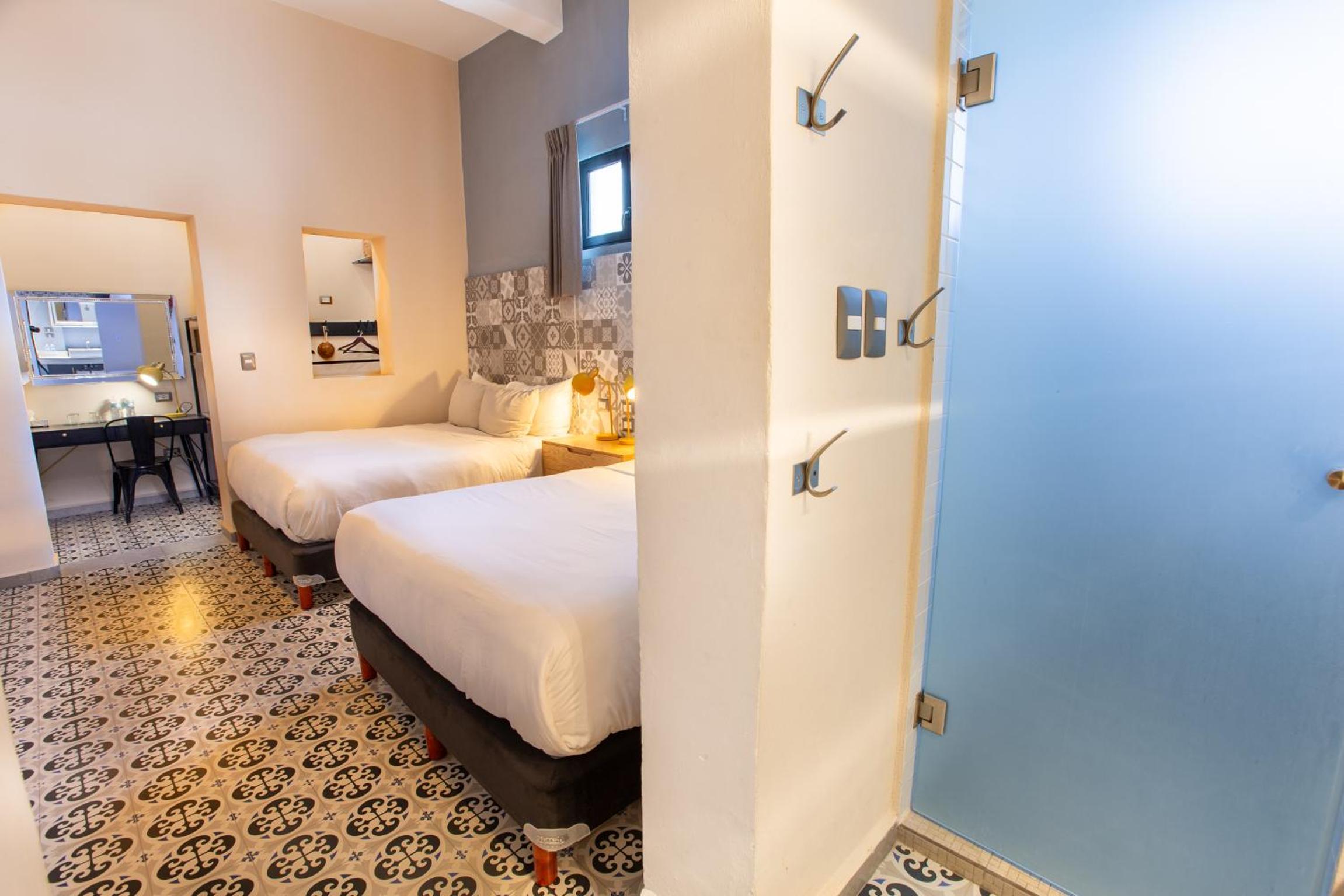 Deluxe Queen Room with Two Queen Beds - Photo 1