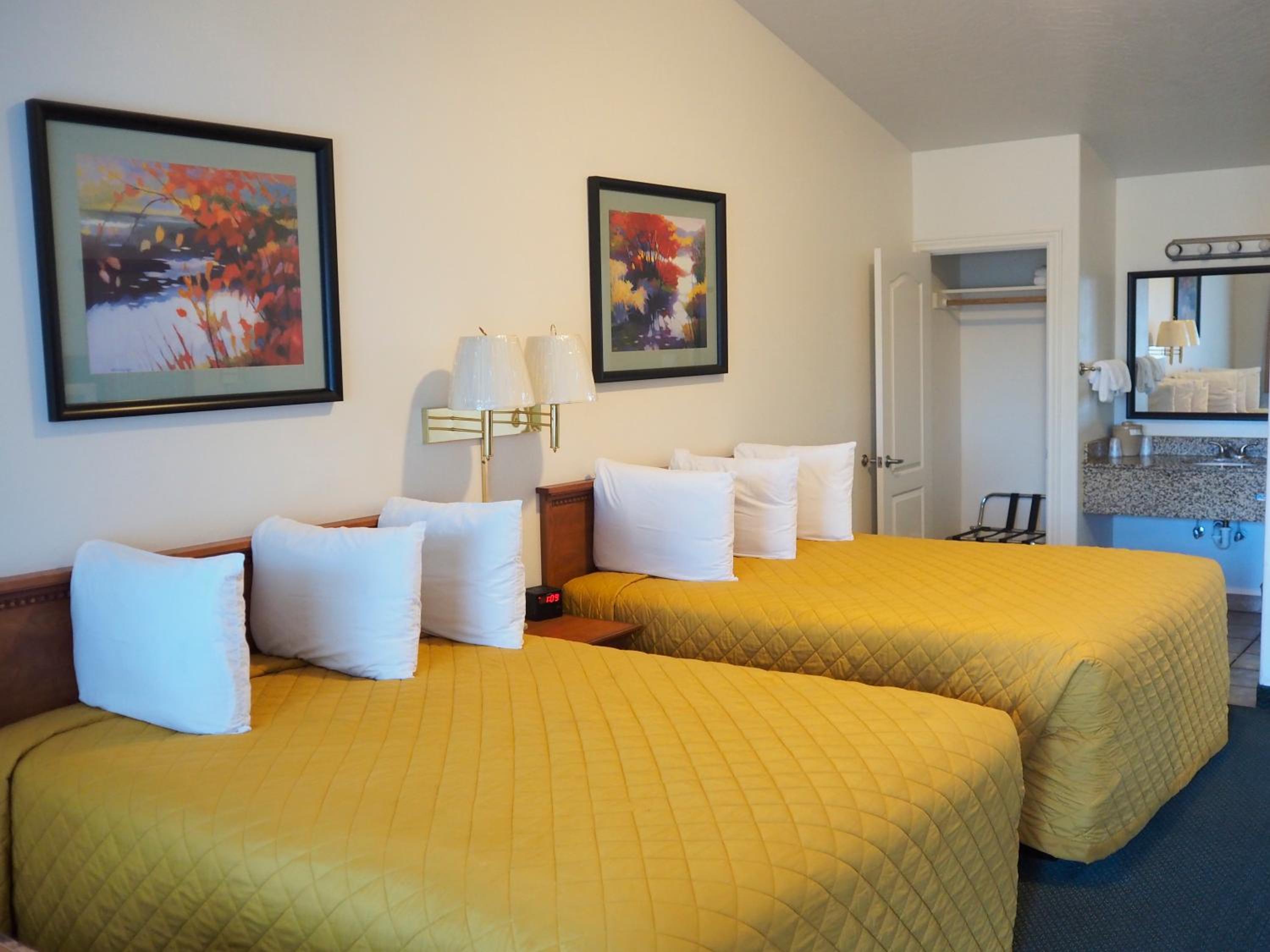 Premium Queen Room with Two Queen Beds - Not Pet Friendly - Photo 1