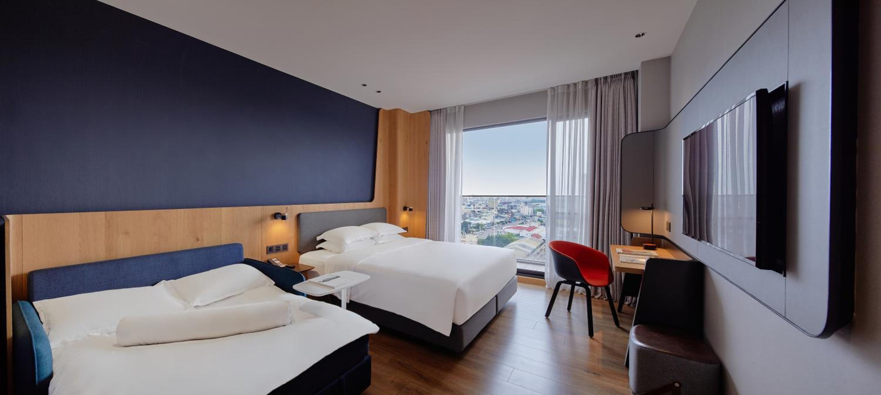 Standard Room with One King Bed and One Queen Bed - Photo 2