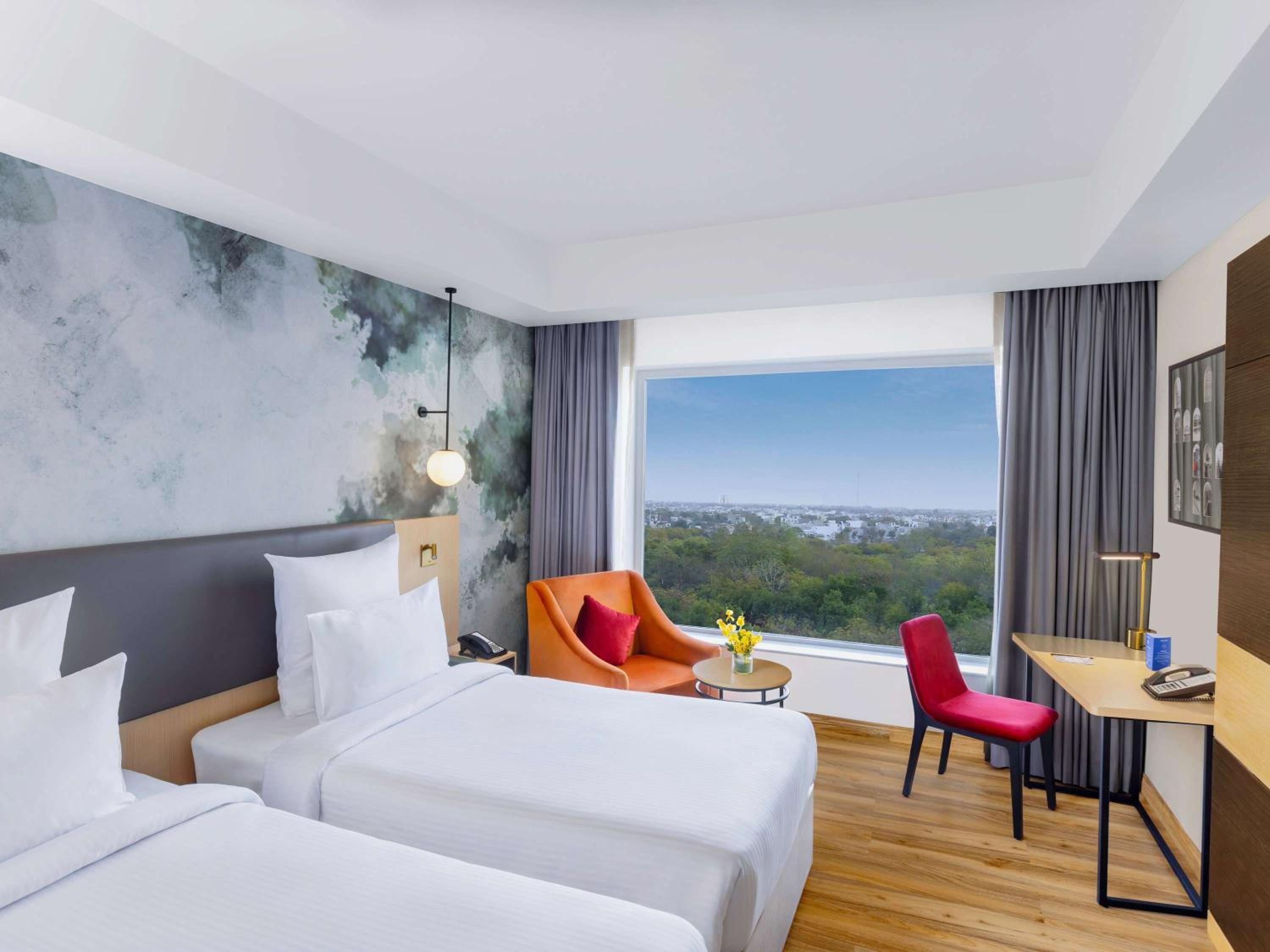 Superior Twin Room - City Side/Non-Smoking: : Avail 15% Off on SPA, 15% off on Food and Soft Beverages, Buy 1 Get 1 on drinks (11 AM-7 PM) at GB*, Free Gaming Zone access, Complimentary Wellness Access (Steam, Sauna, Gym), Kids stay Complimentary - Photo 1