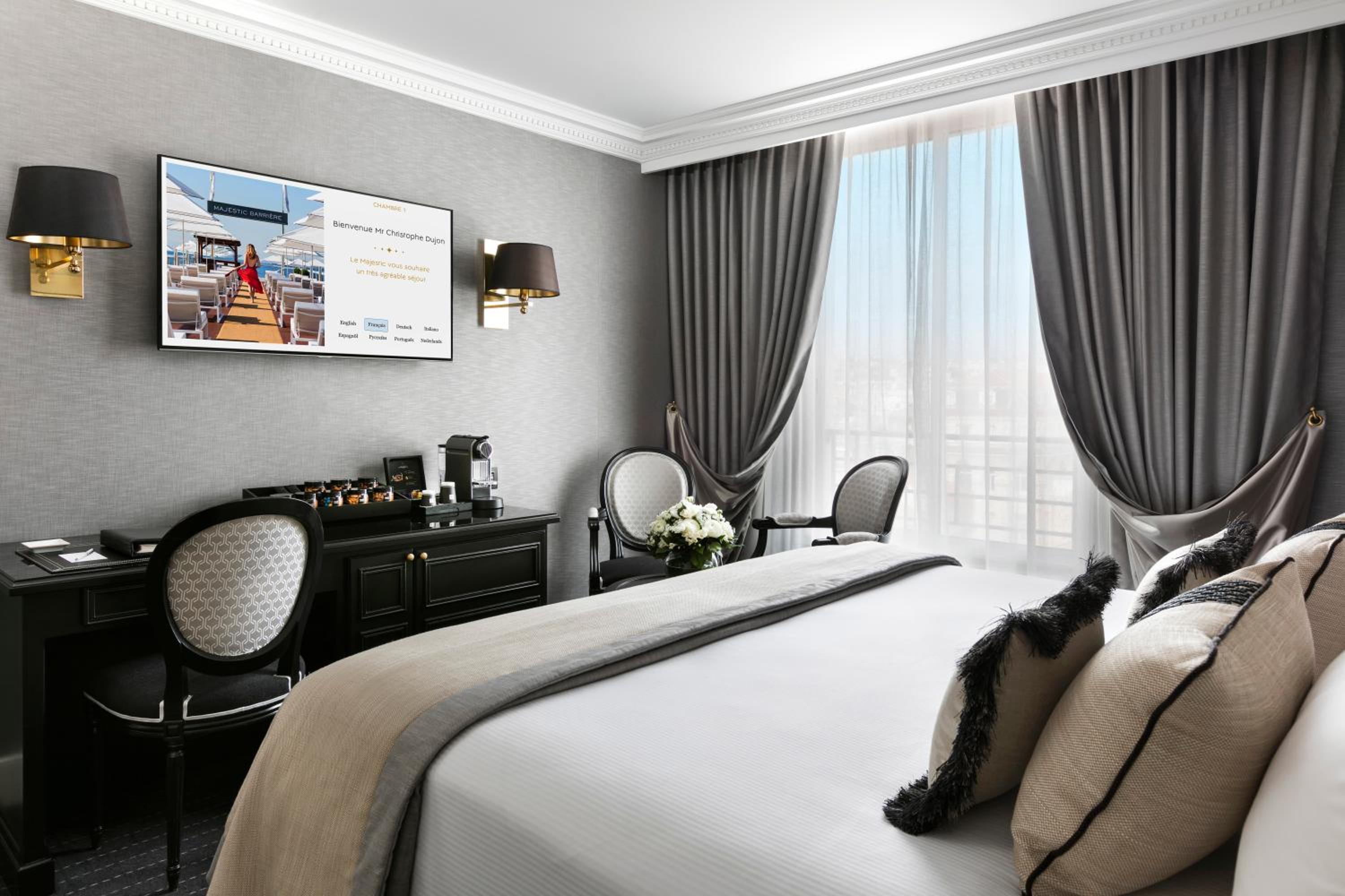 hotel room with a large bed and a flat screen tv