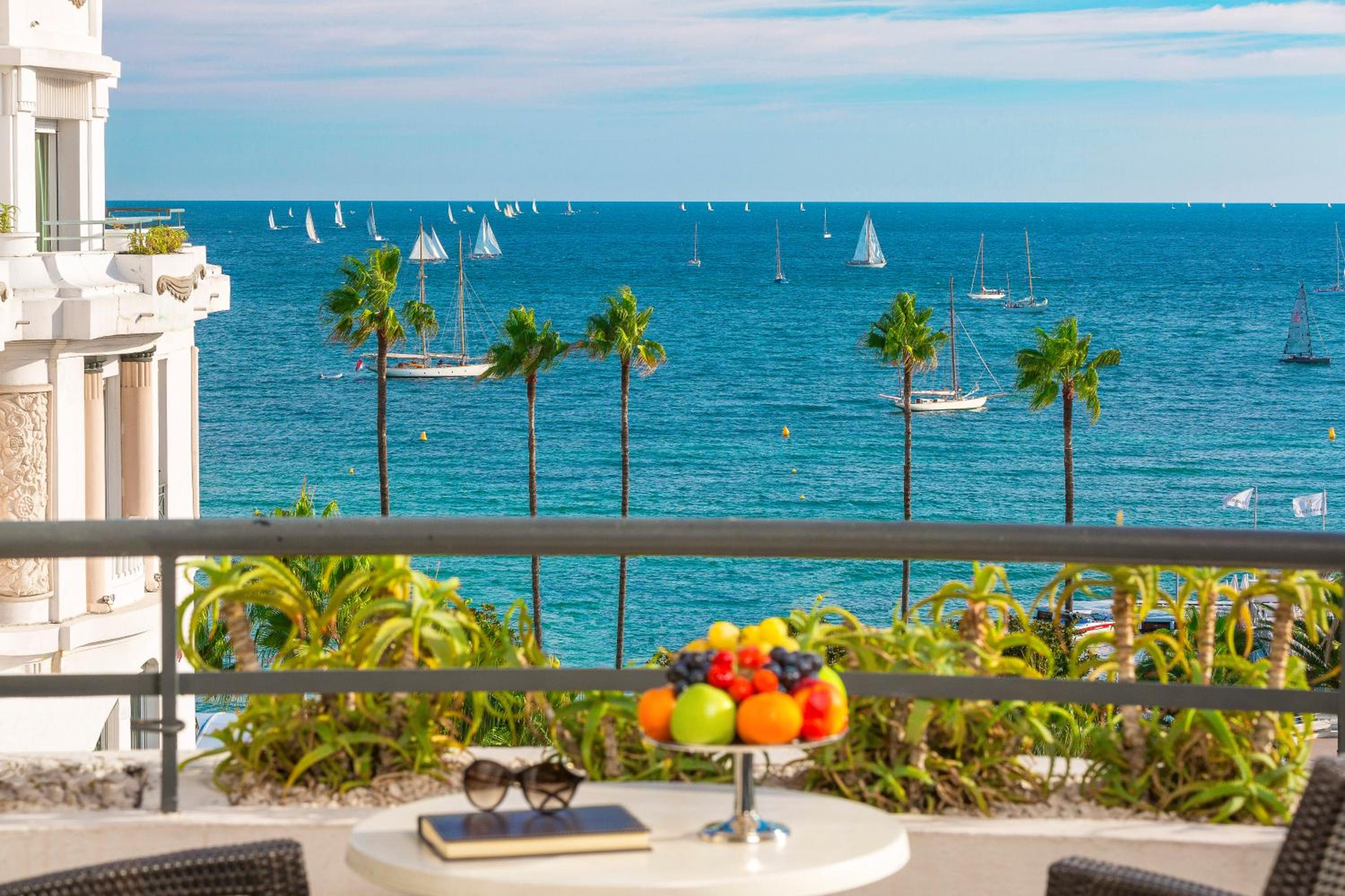 view of the ocean and sailboats in the distance