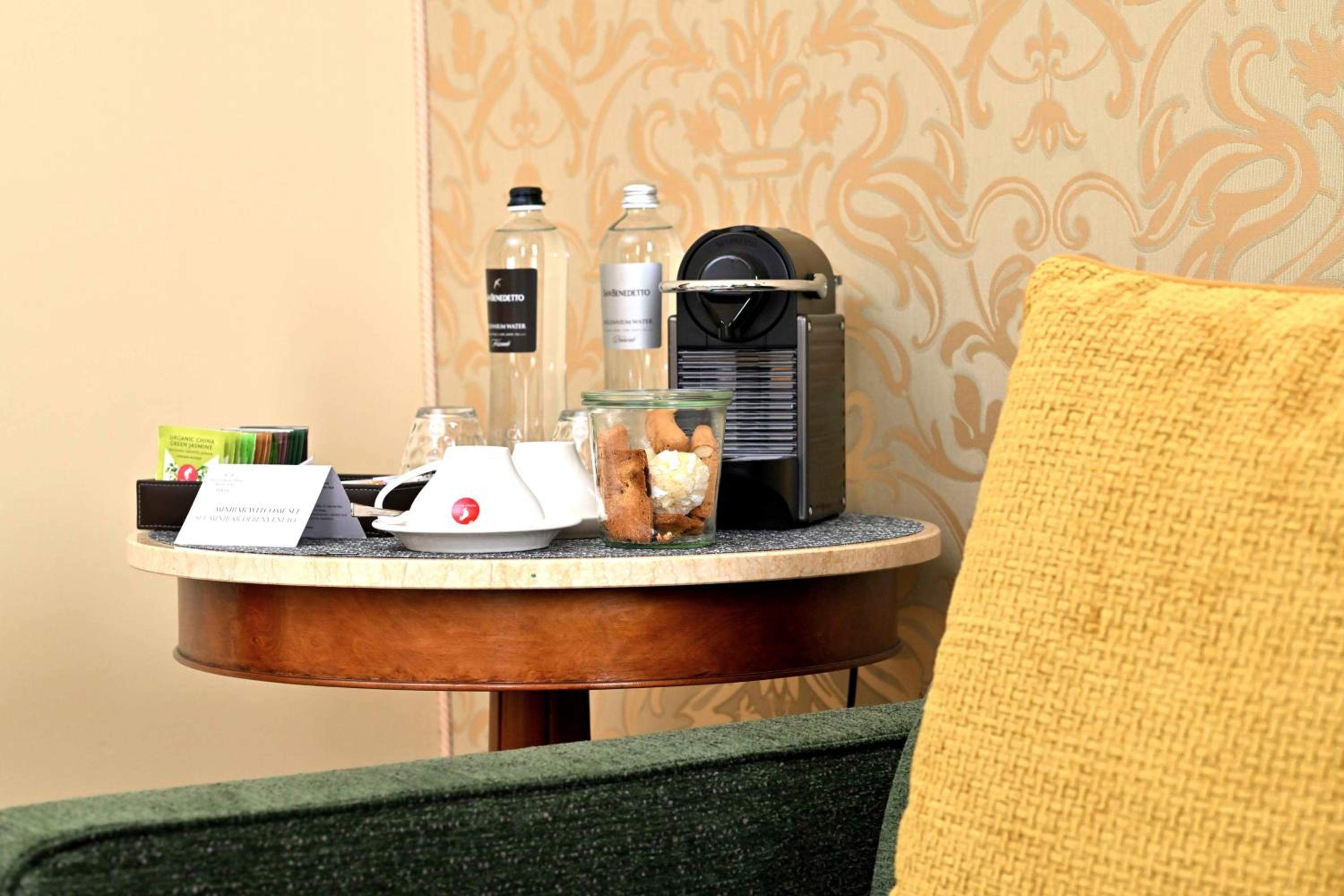 coffee maker on a small table in a hotel room