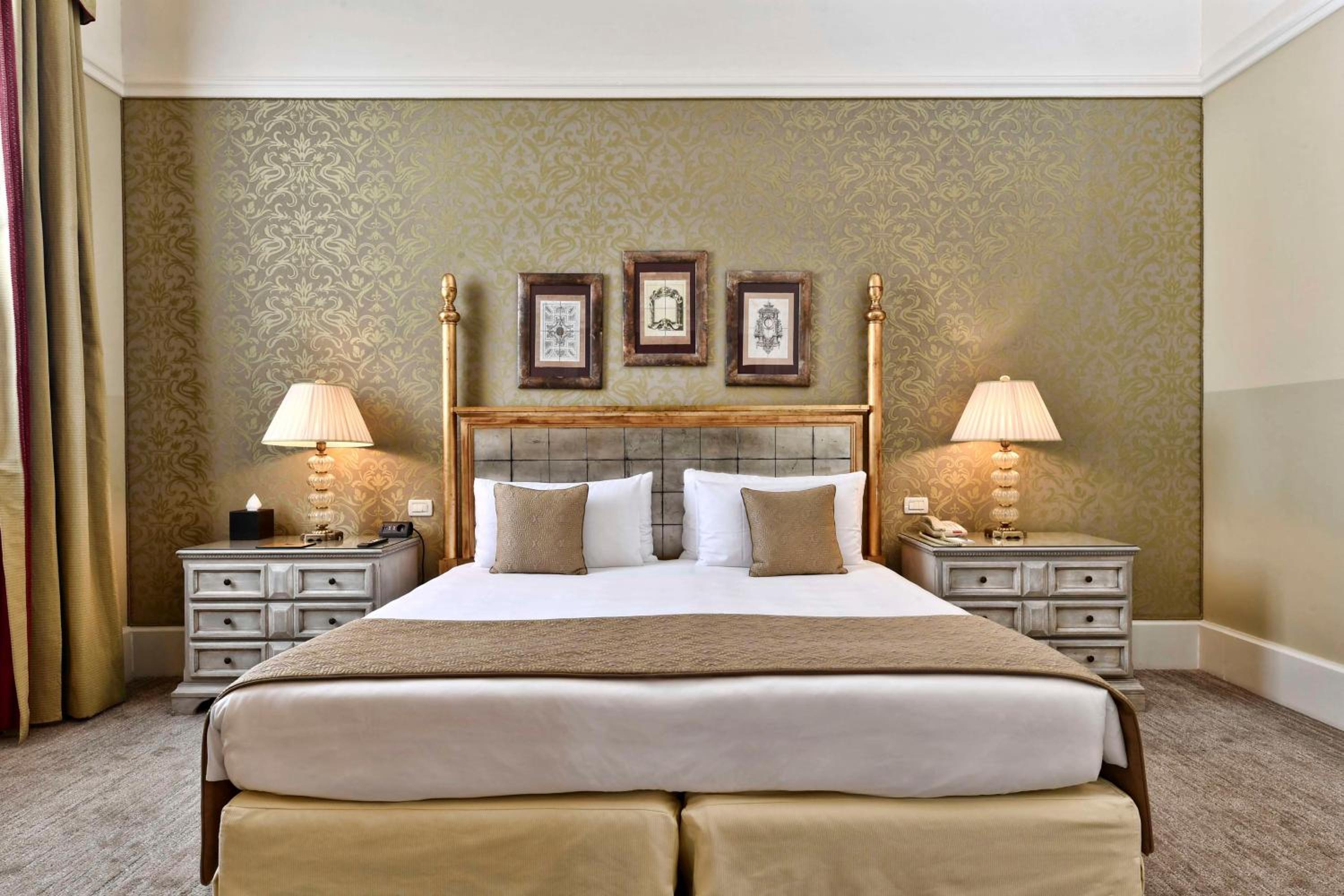 bedroom with a bed and two lamps on either side of the bed