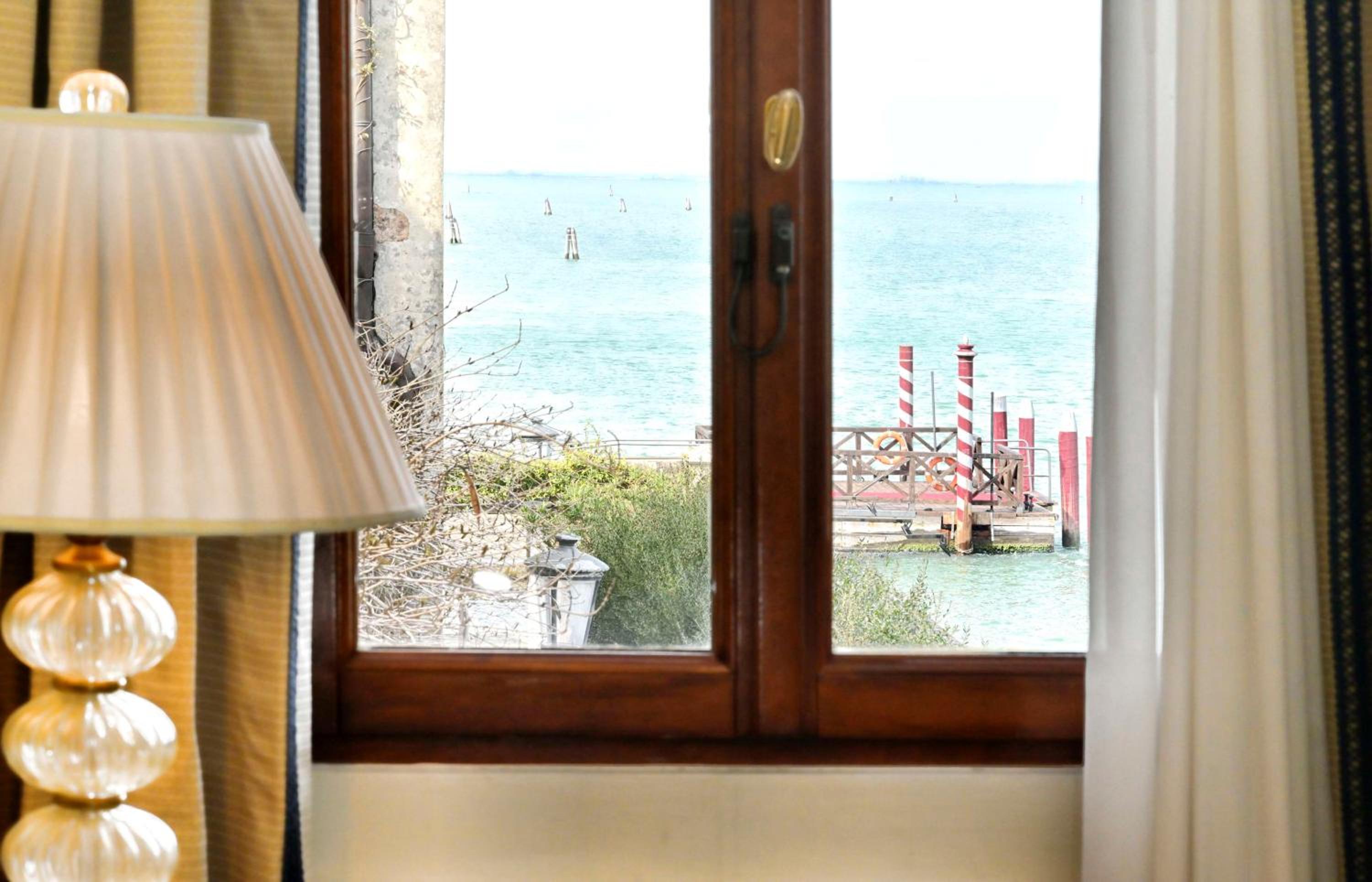 view out the window of a hotel room overlooking the water