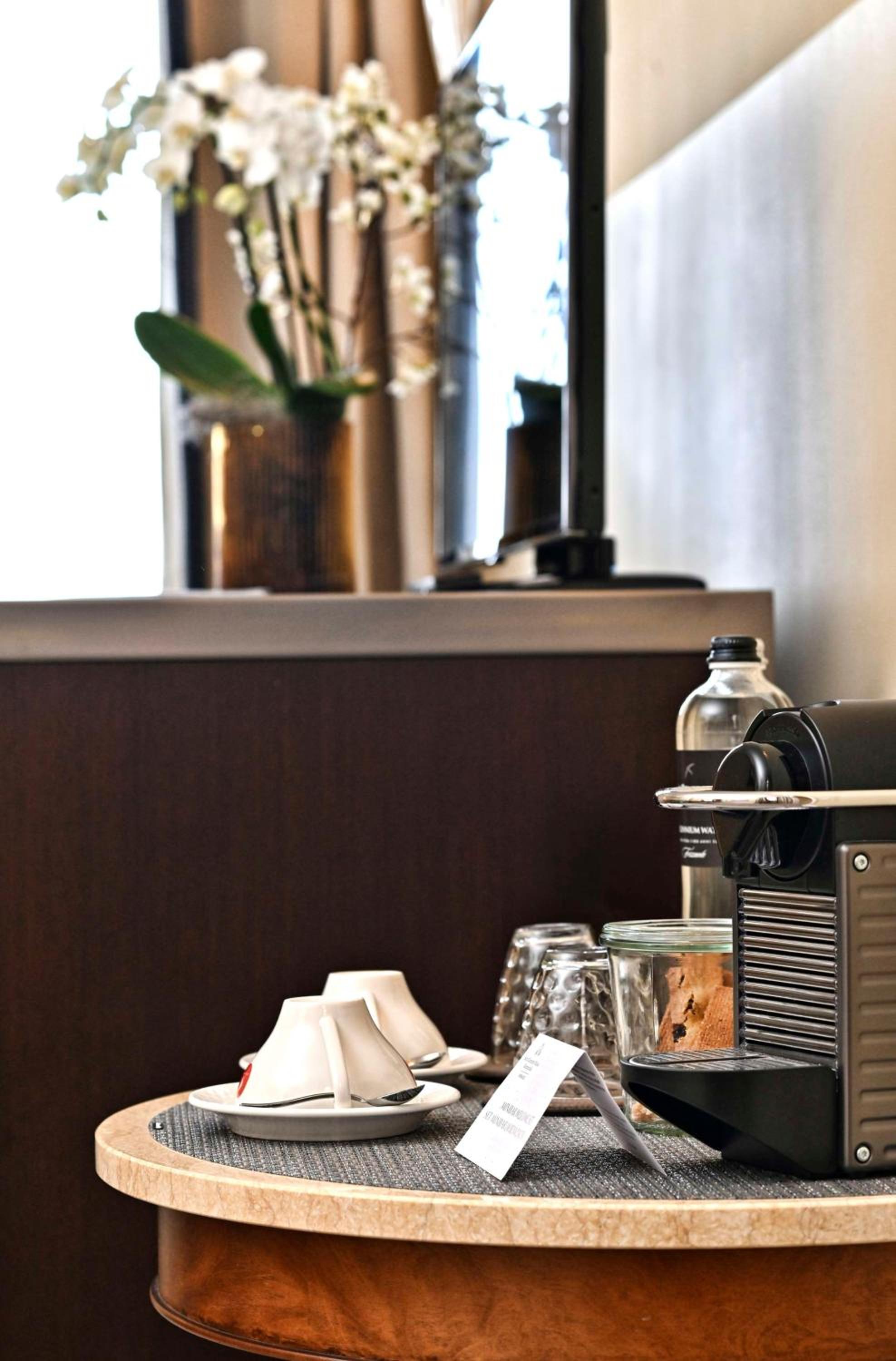 coffee machine sitting on a table in a hotel room