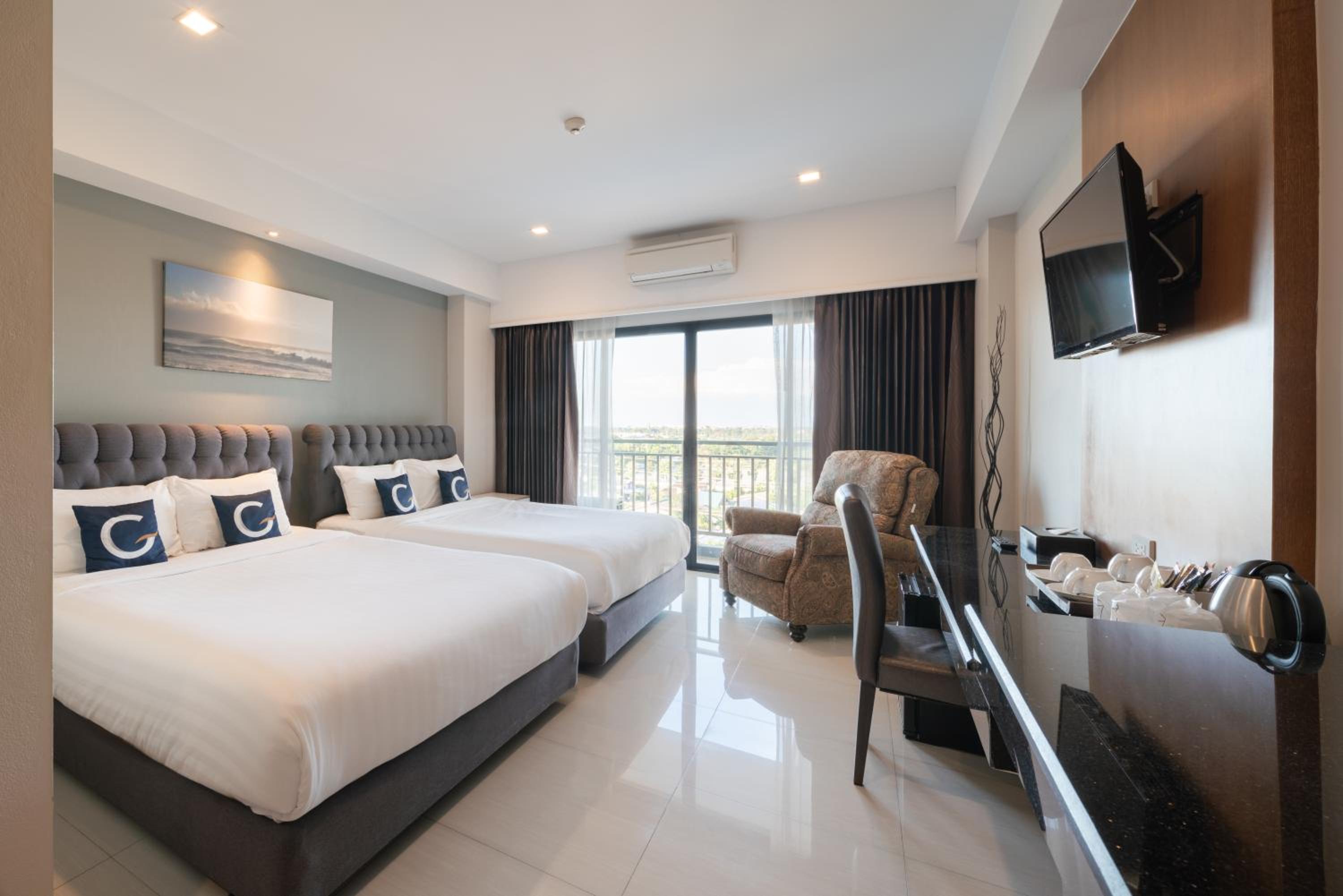 Family Room with Balcony - Free Airport Shuttle photo 1