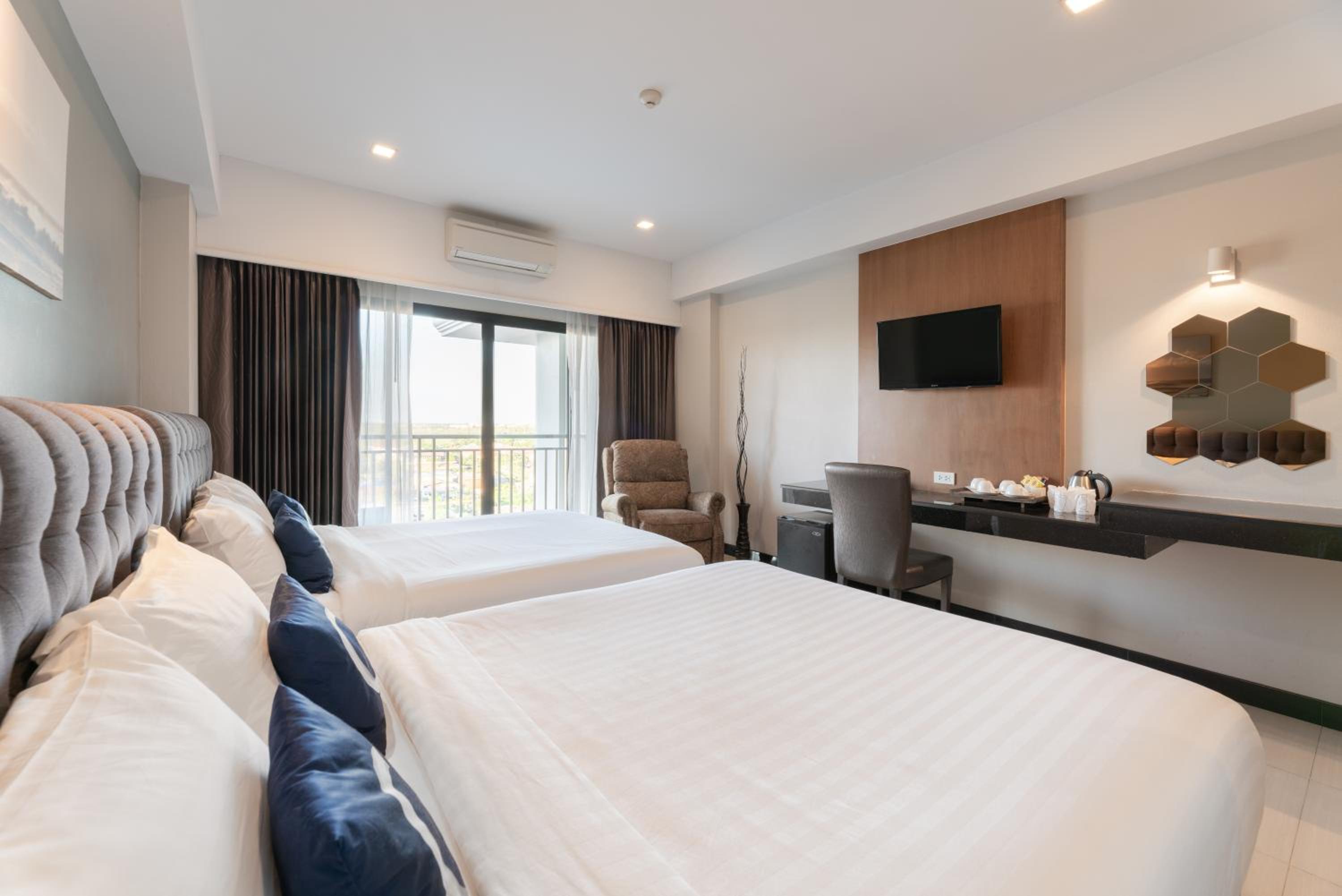 Family Room with Balcony - Free Airport Shuttle photo 3