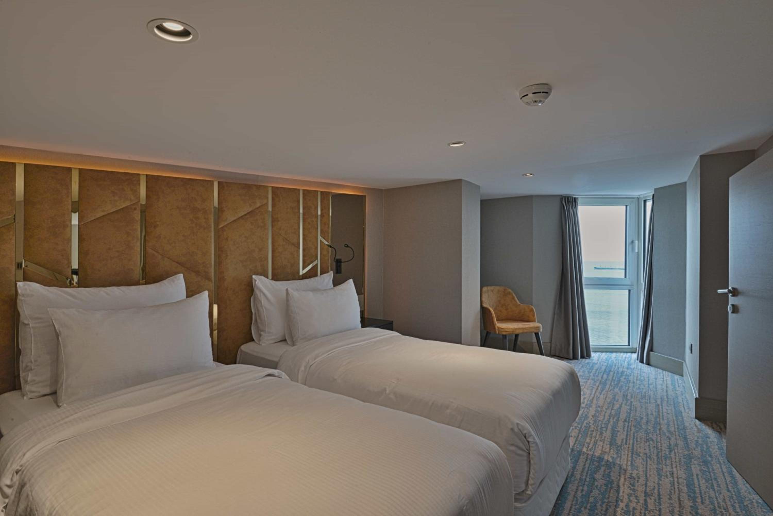 Duplex Suite with One Queen Bed and Two Single Beds with Balcony and View