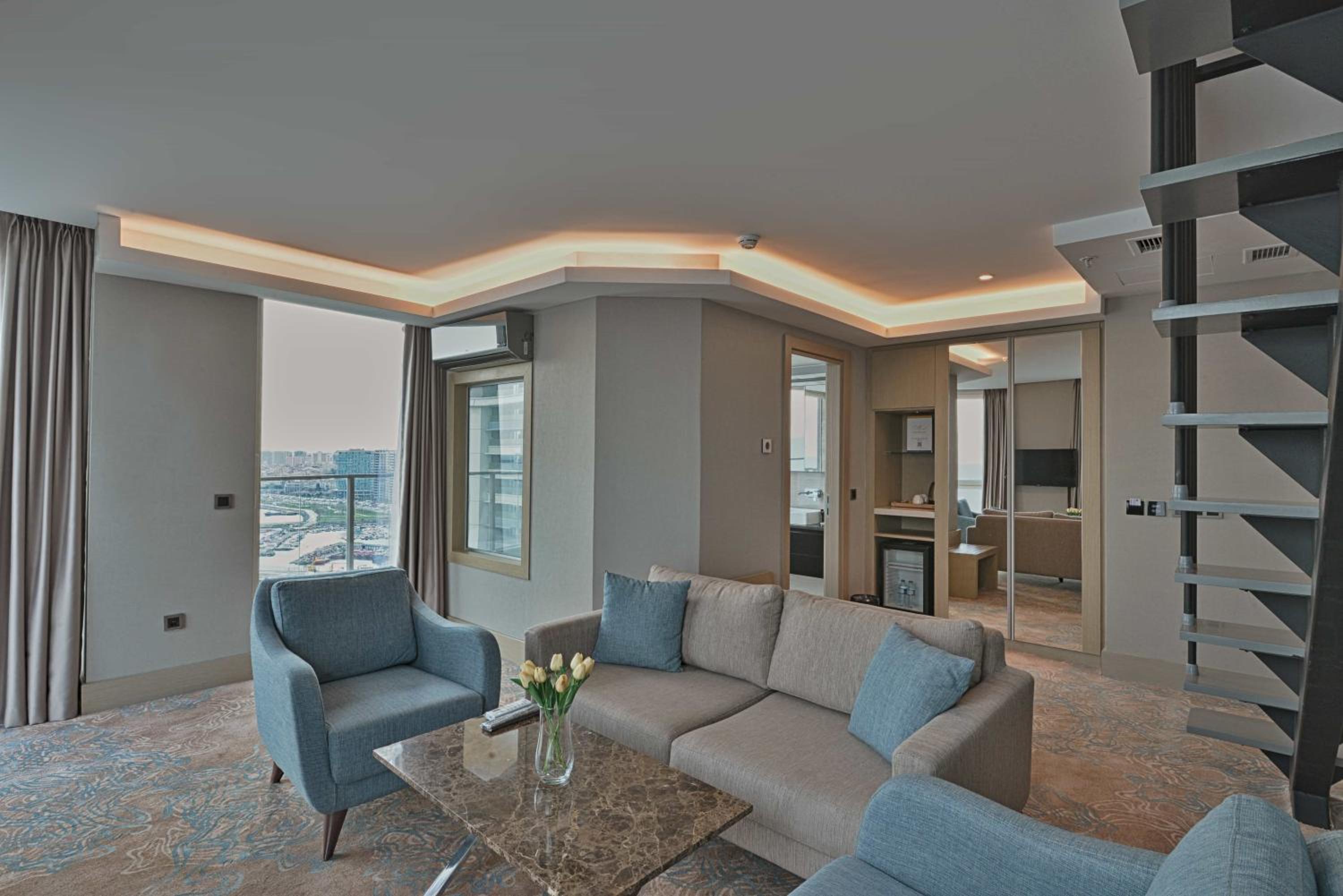 Duplex Suite with One Queen Bed and Two Single Beds with Balcony and View