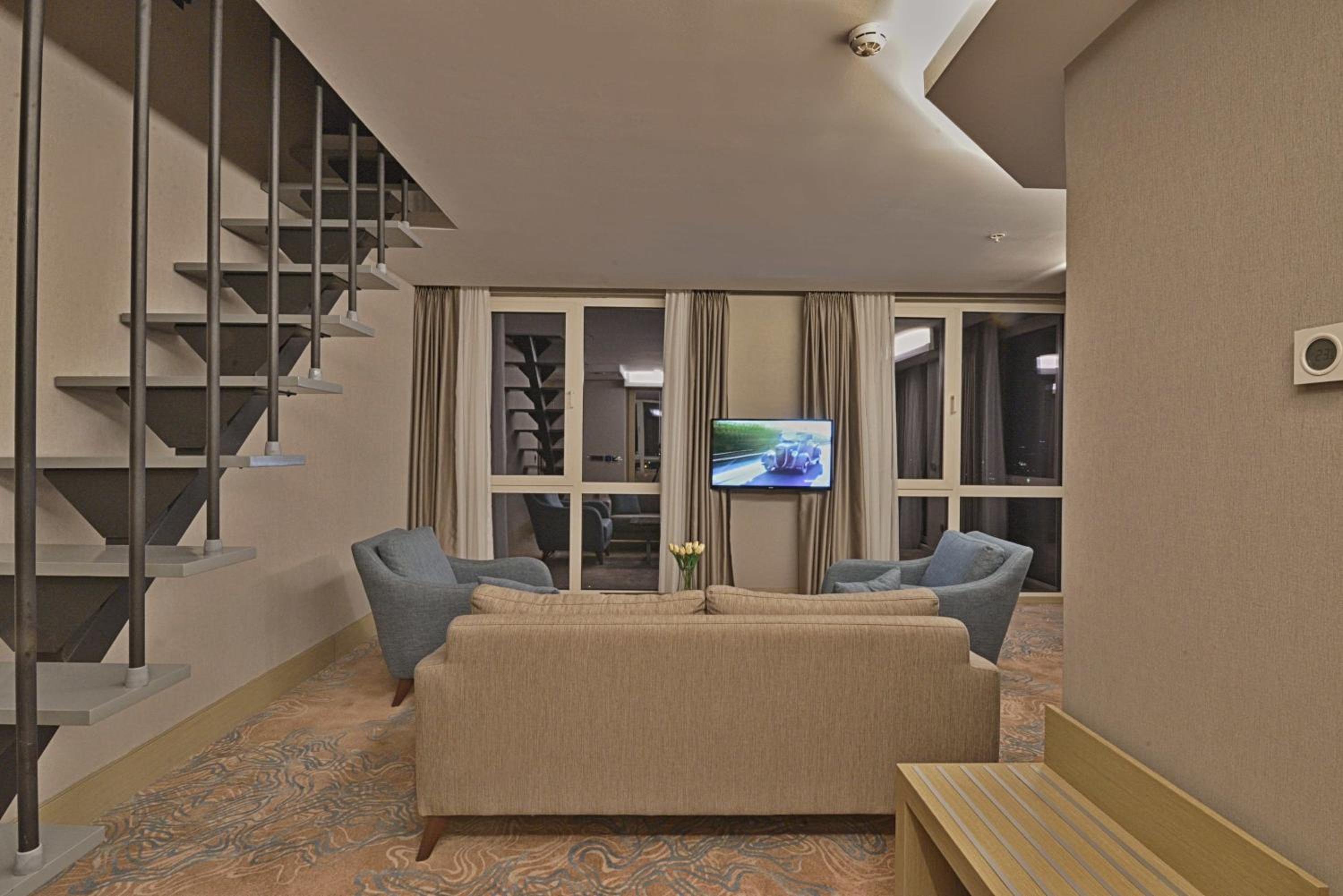 Duplex Suite with One Queen Bed and Two Single Beds with Balcony and View