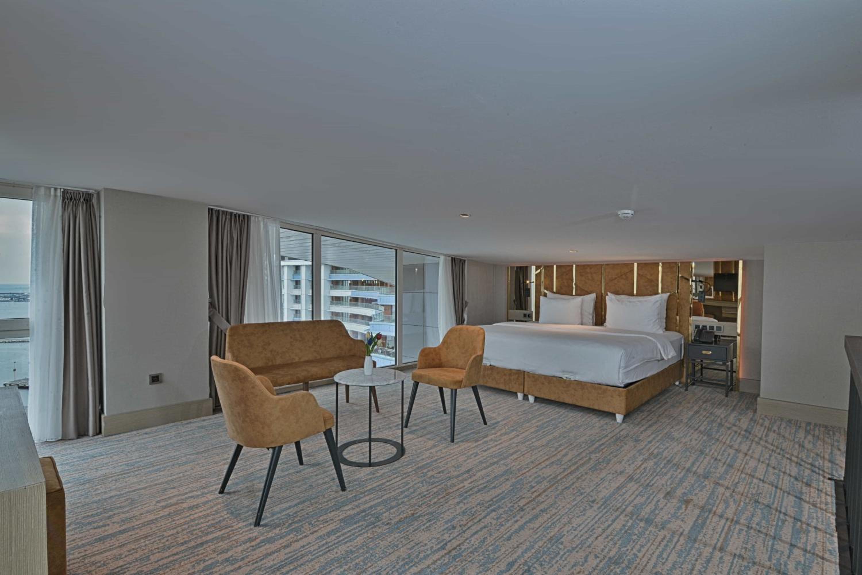 Duplex Suite with One Queen Bed and Two Single Beds with Balcony and View