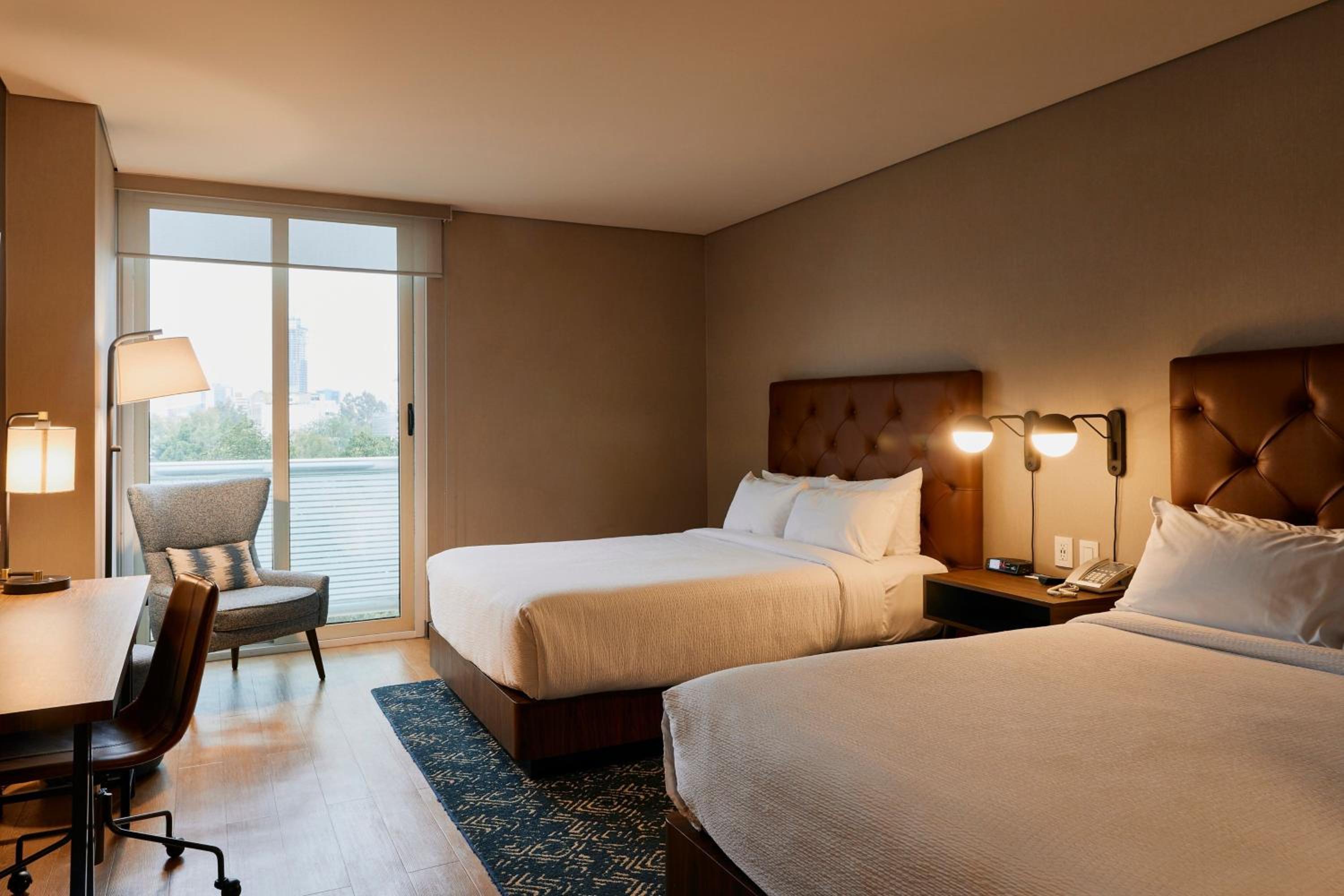 Standard Queen Room with Two Queen Beds - Photo 7