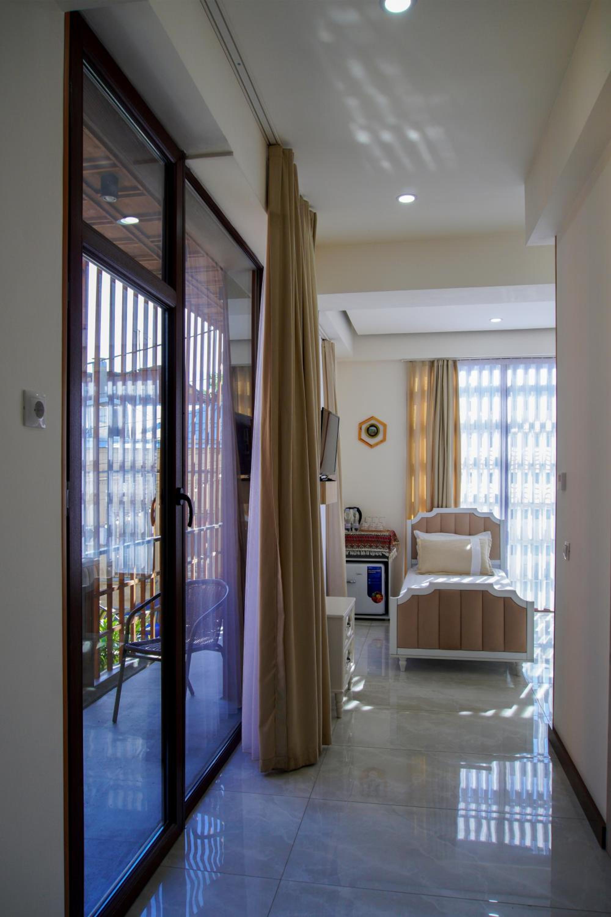 Quadruple Room with Balcony photo 3