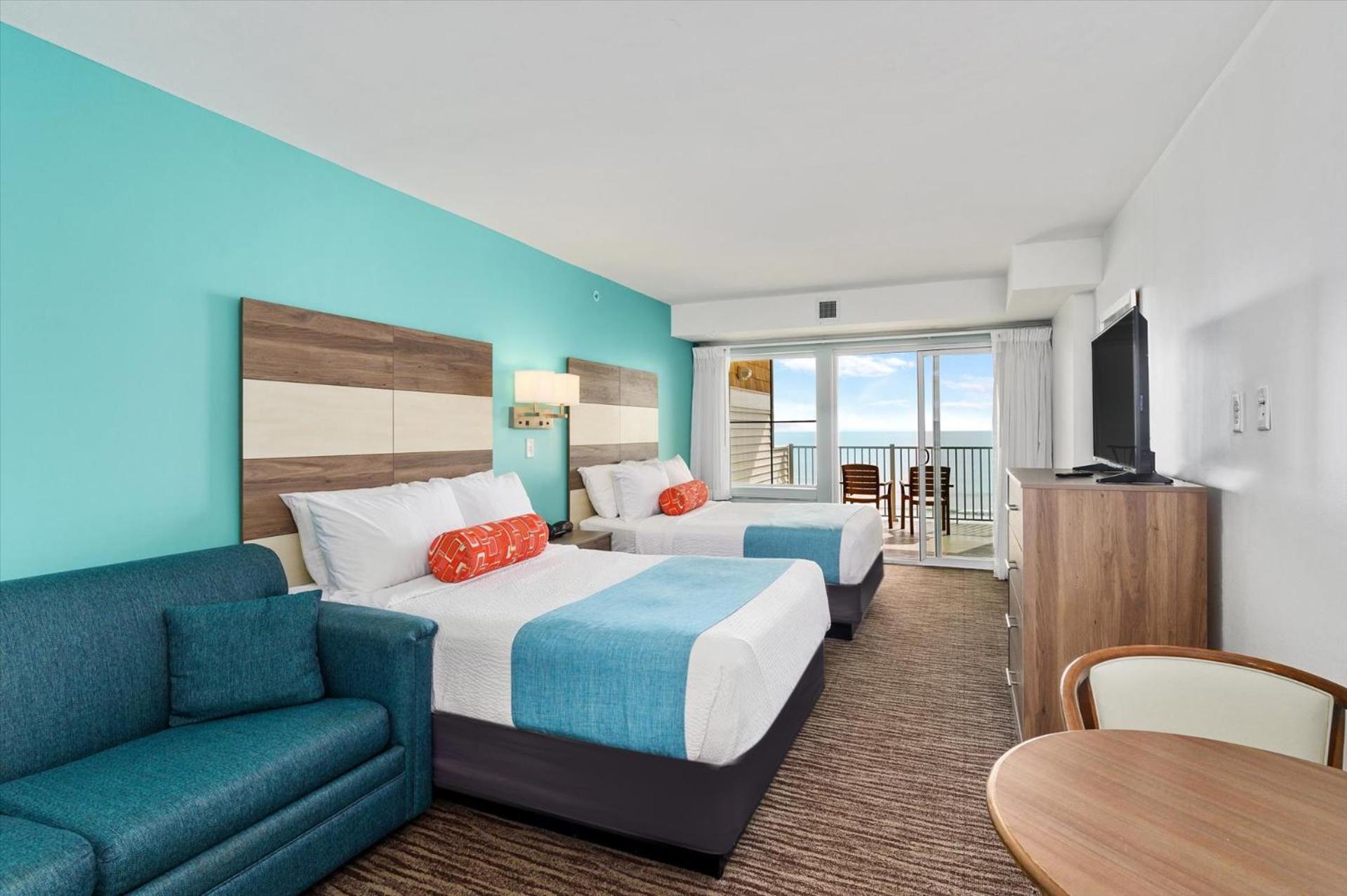 Ocean Front Room with Balcony, 2 Double Beds, Sofa and Kitchenette