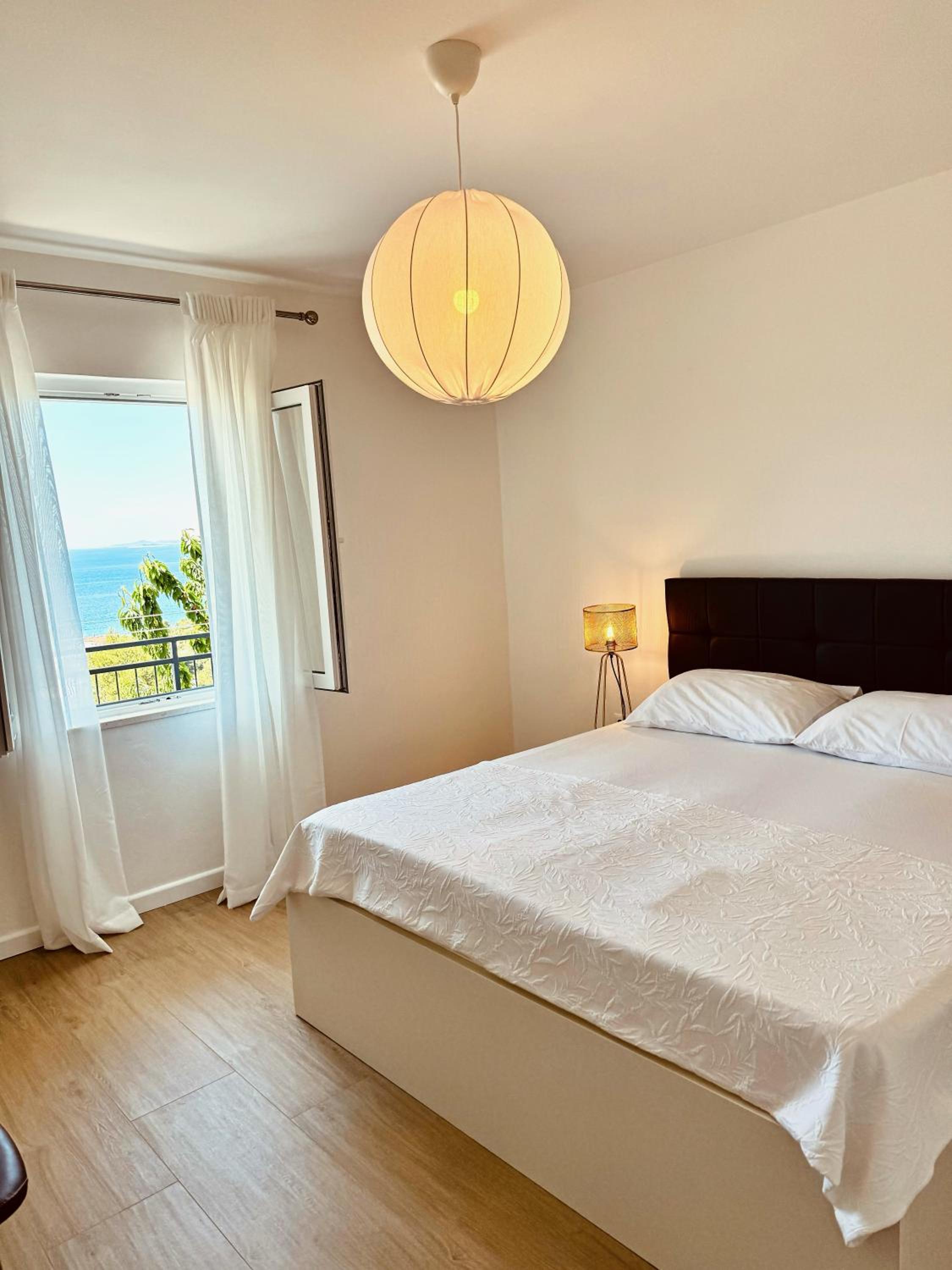 Three-Bedroom Apartment with Balcony and Sea View