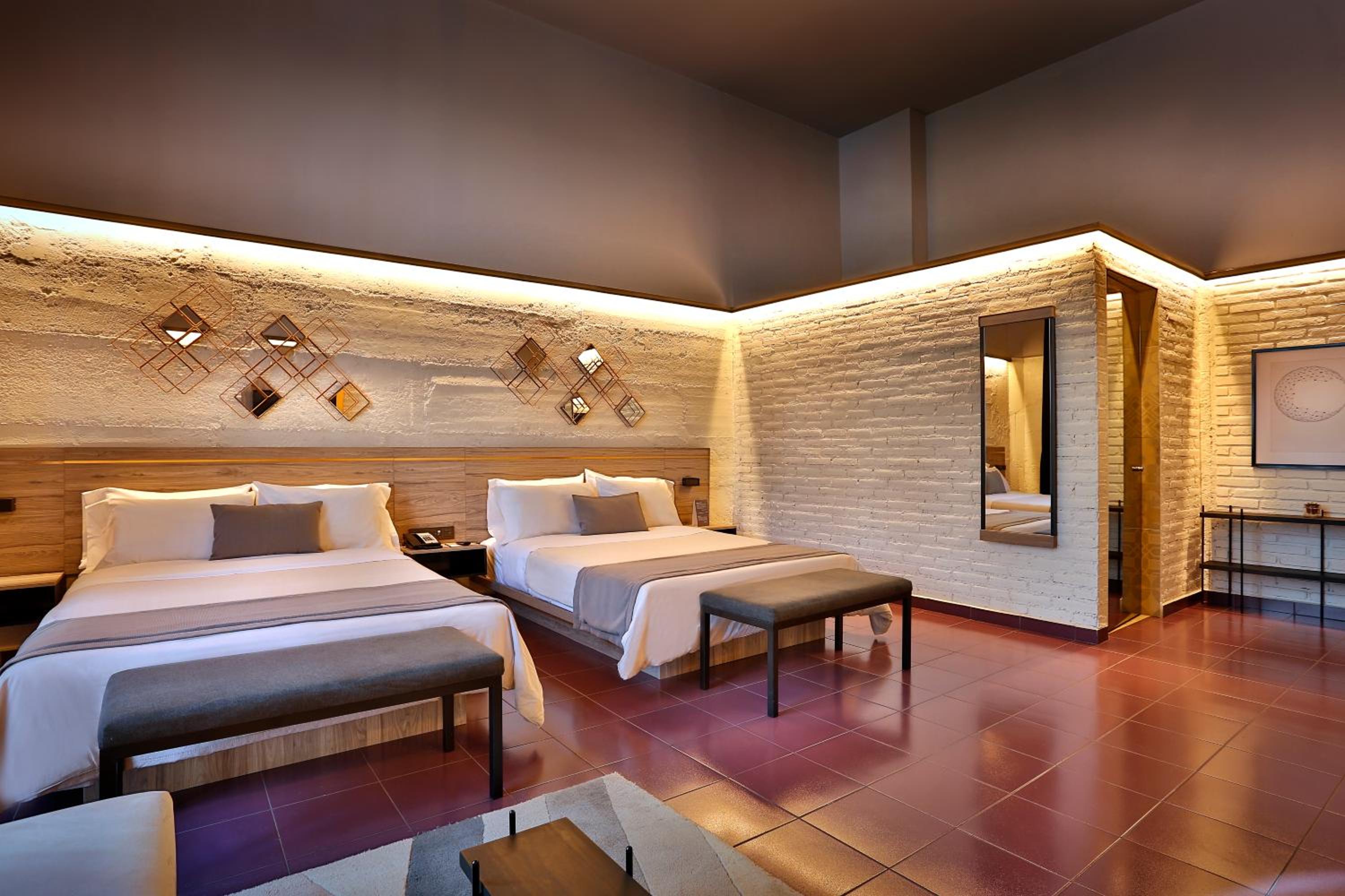 Queen Suite with Two Queen Beds and Sofa Bed