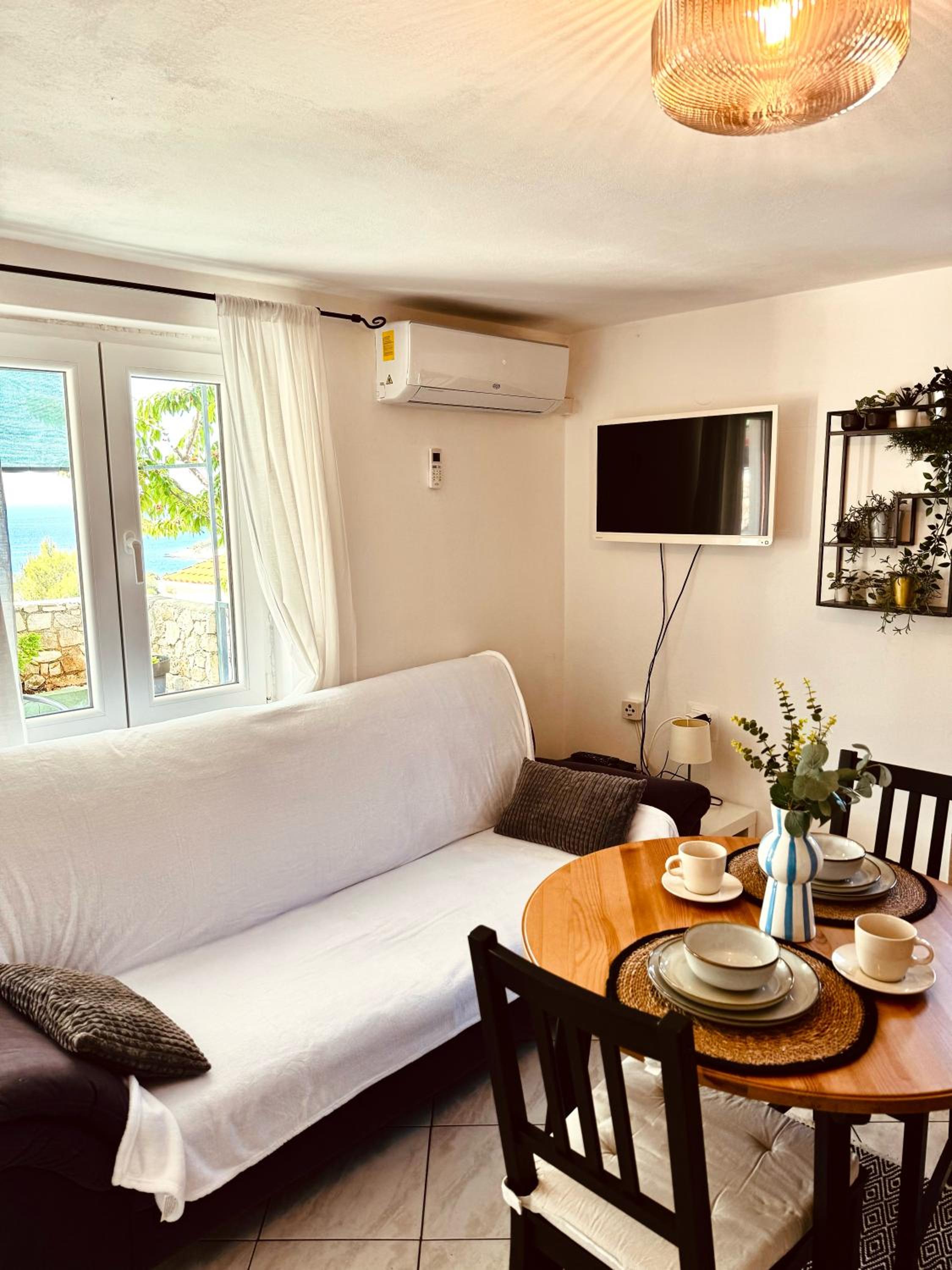 One-Bedroom Apartment with Balcony and Sea View