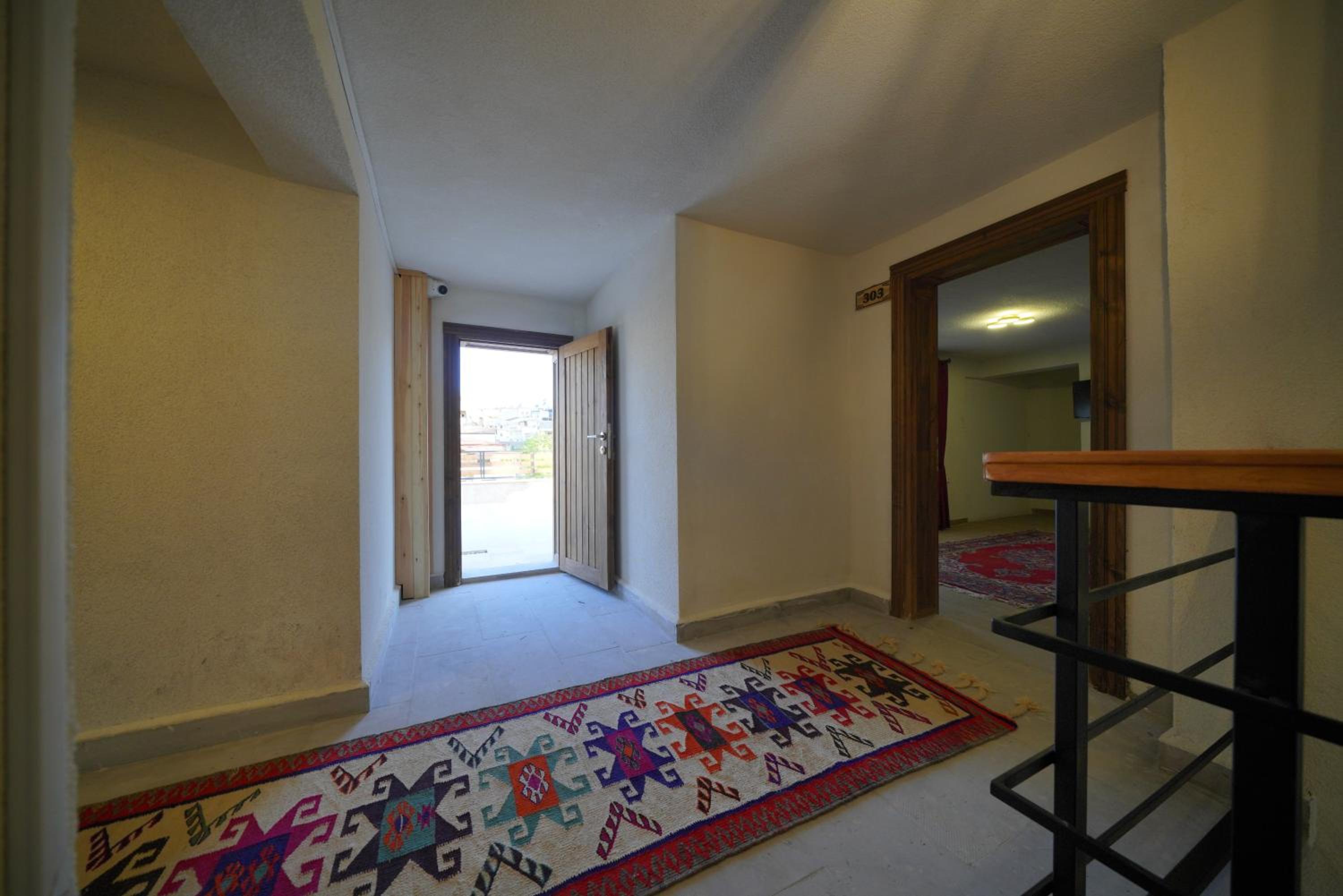 Superior Triple Room with Balcony and Garden View