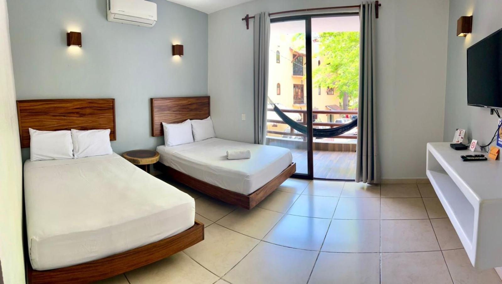 Deluxe Queen Room with Two Queen Beds - Photo 1
