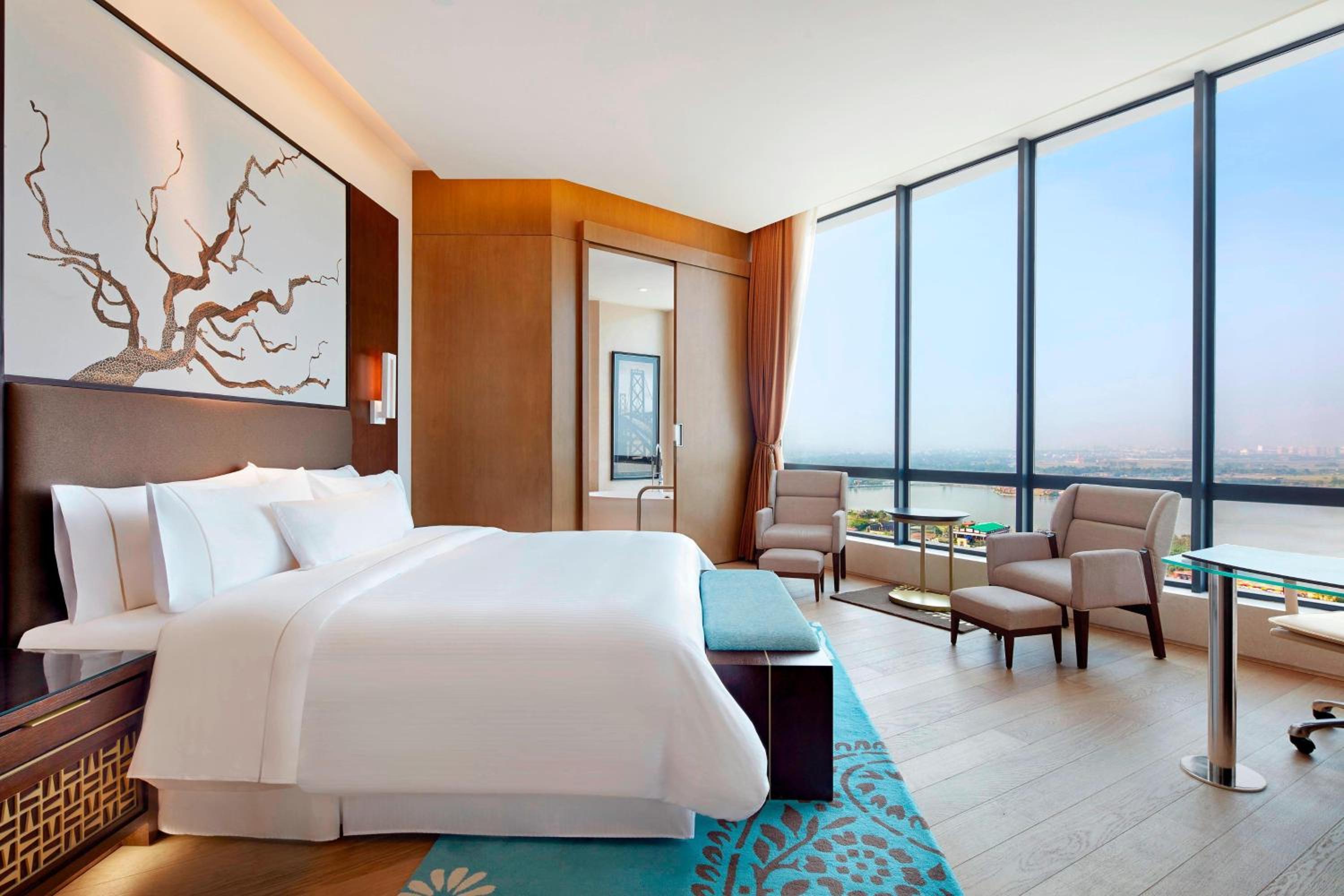 Deluxe Suite with 20% F&B Discount, Happy Hours (1 + 1 IMFL - 4 pm to 8 pm at 31/32) & 2 Way Airport Transfers
