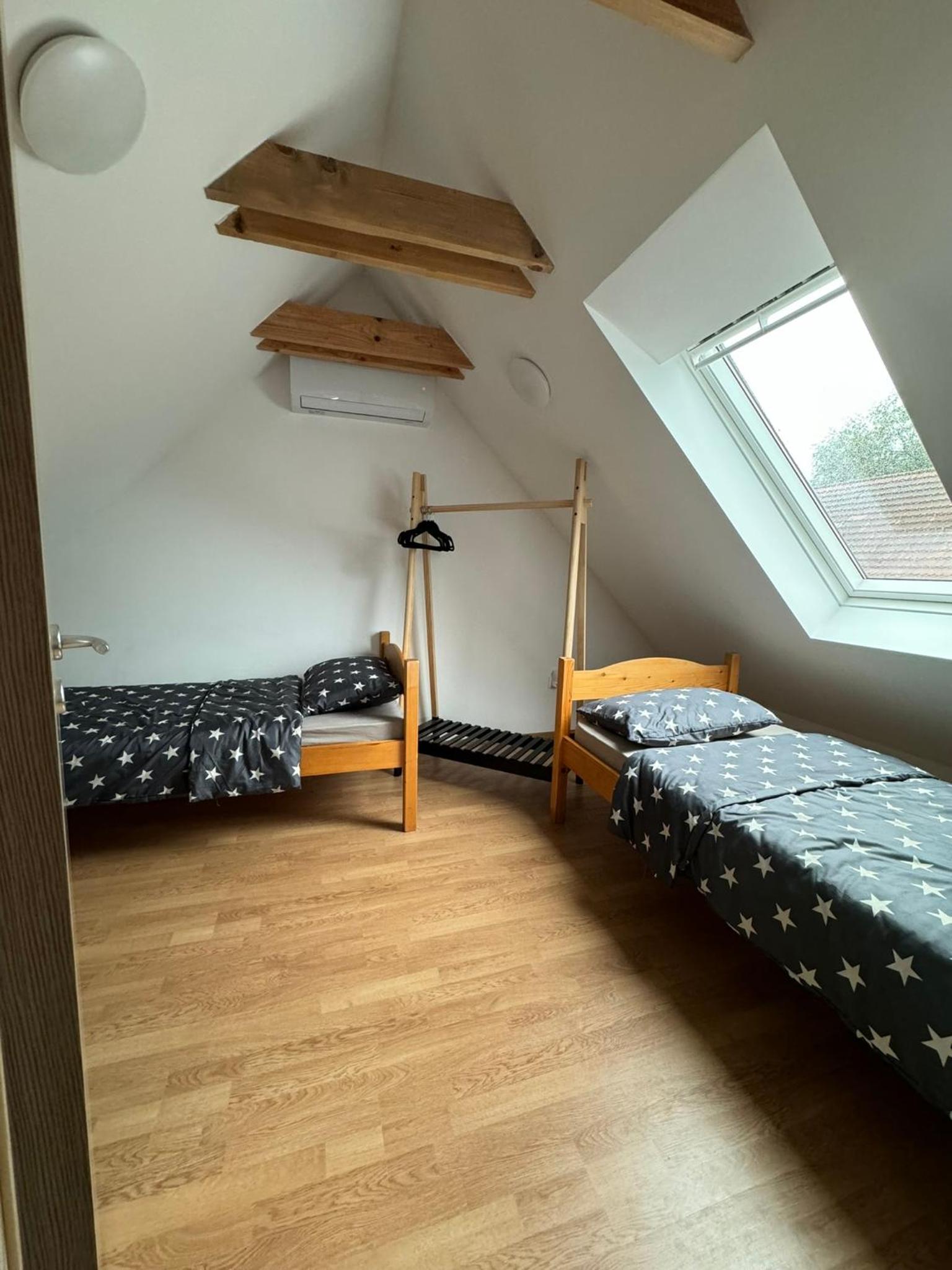 Three-Bedroom House - Photo 24