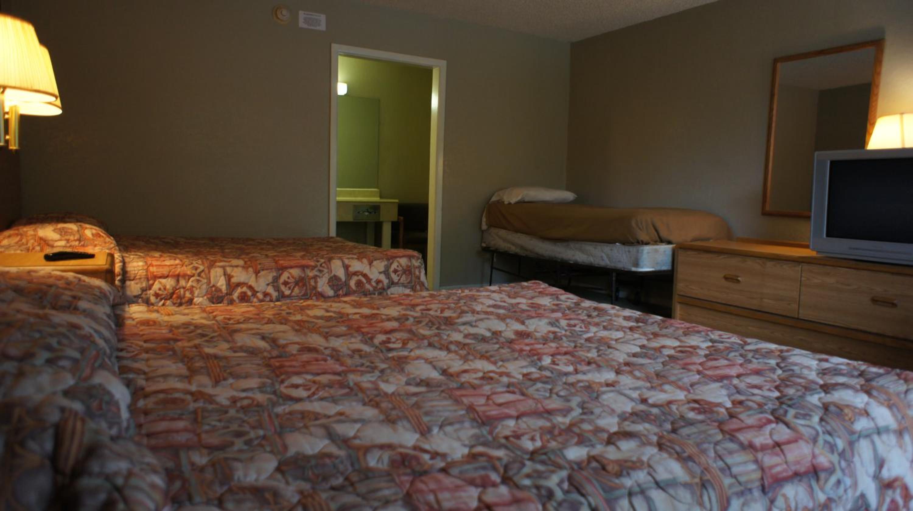 Two Double Beds with One Twin Bed