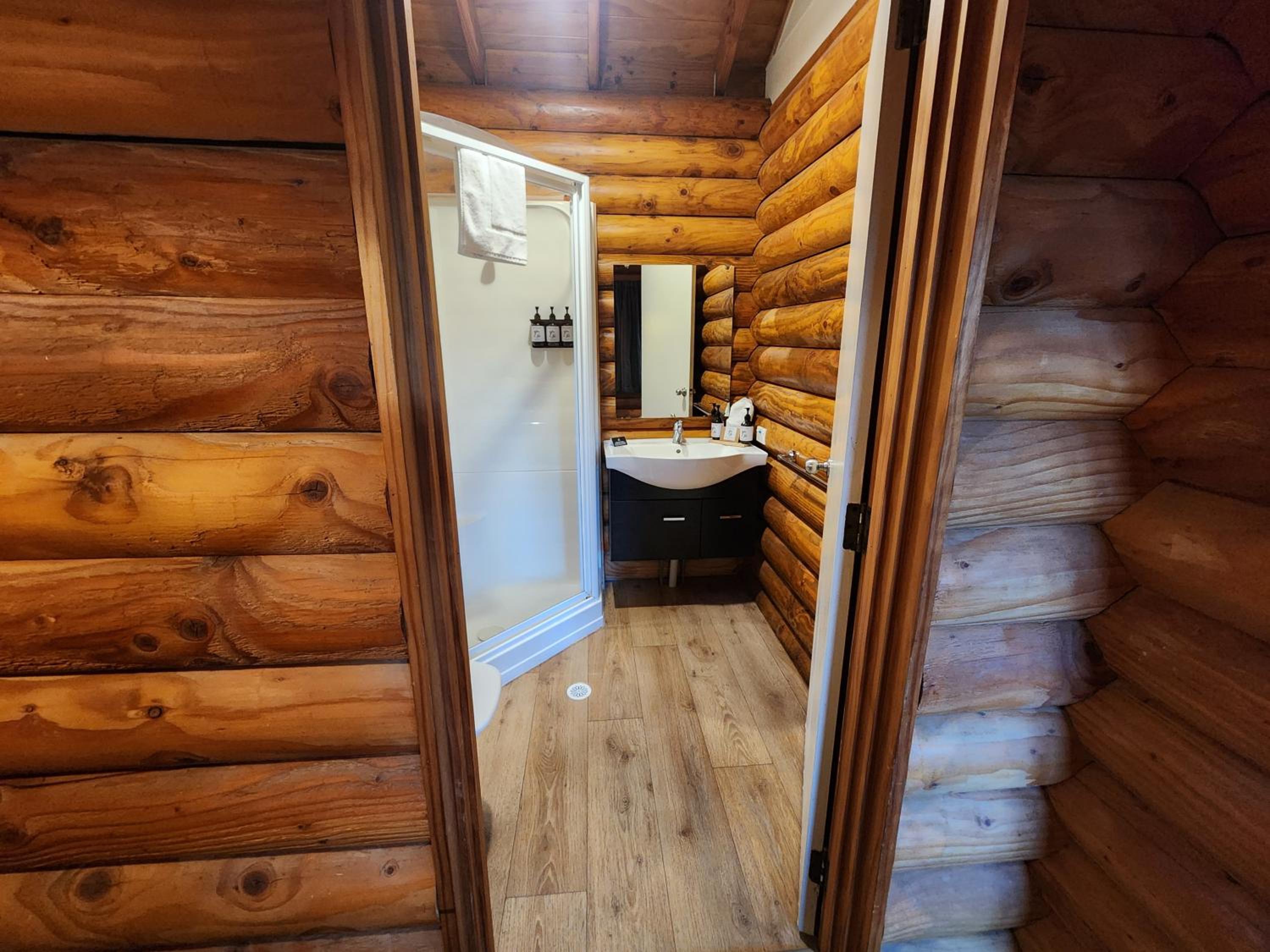 1 single bed in a 3 Bed Log Cabin Dorm (No Bunks) photo 1