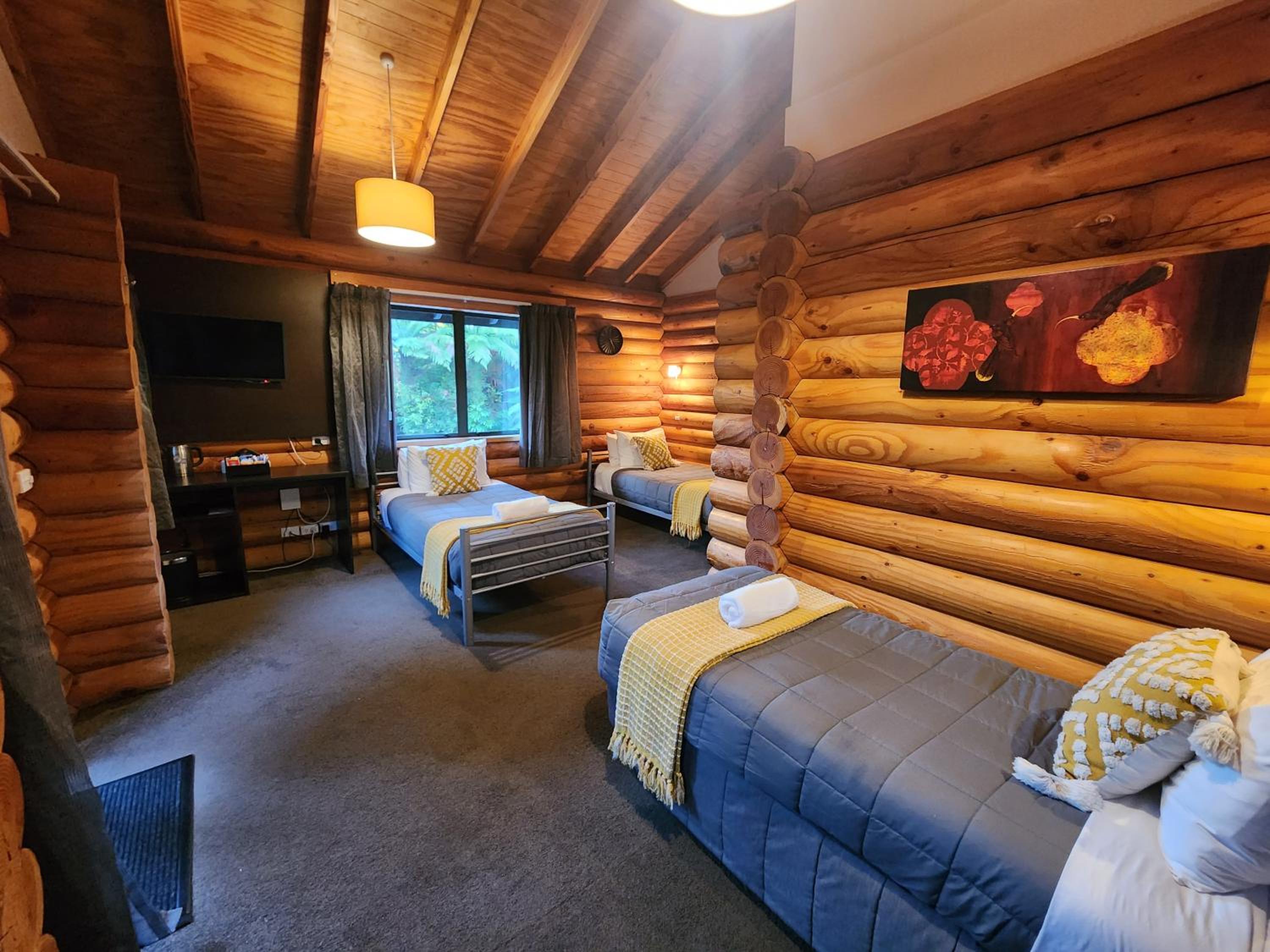 1 single bed in a 3 Bed Log Cabin Dorm (No Bunks) photo 2