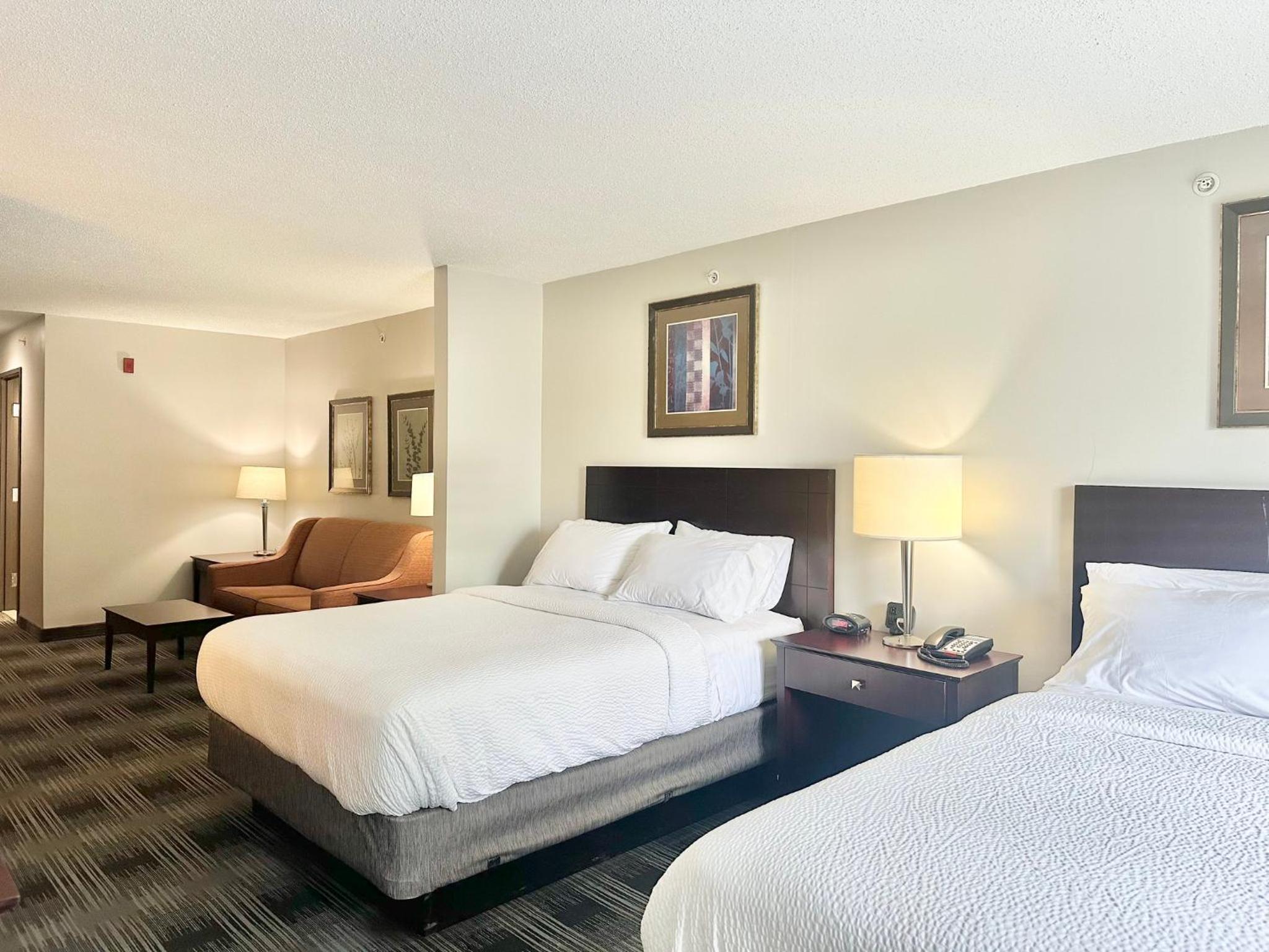 Queen Suite with Two Queen Beds and Sofa Bed - Photo 1