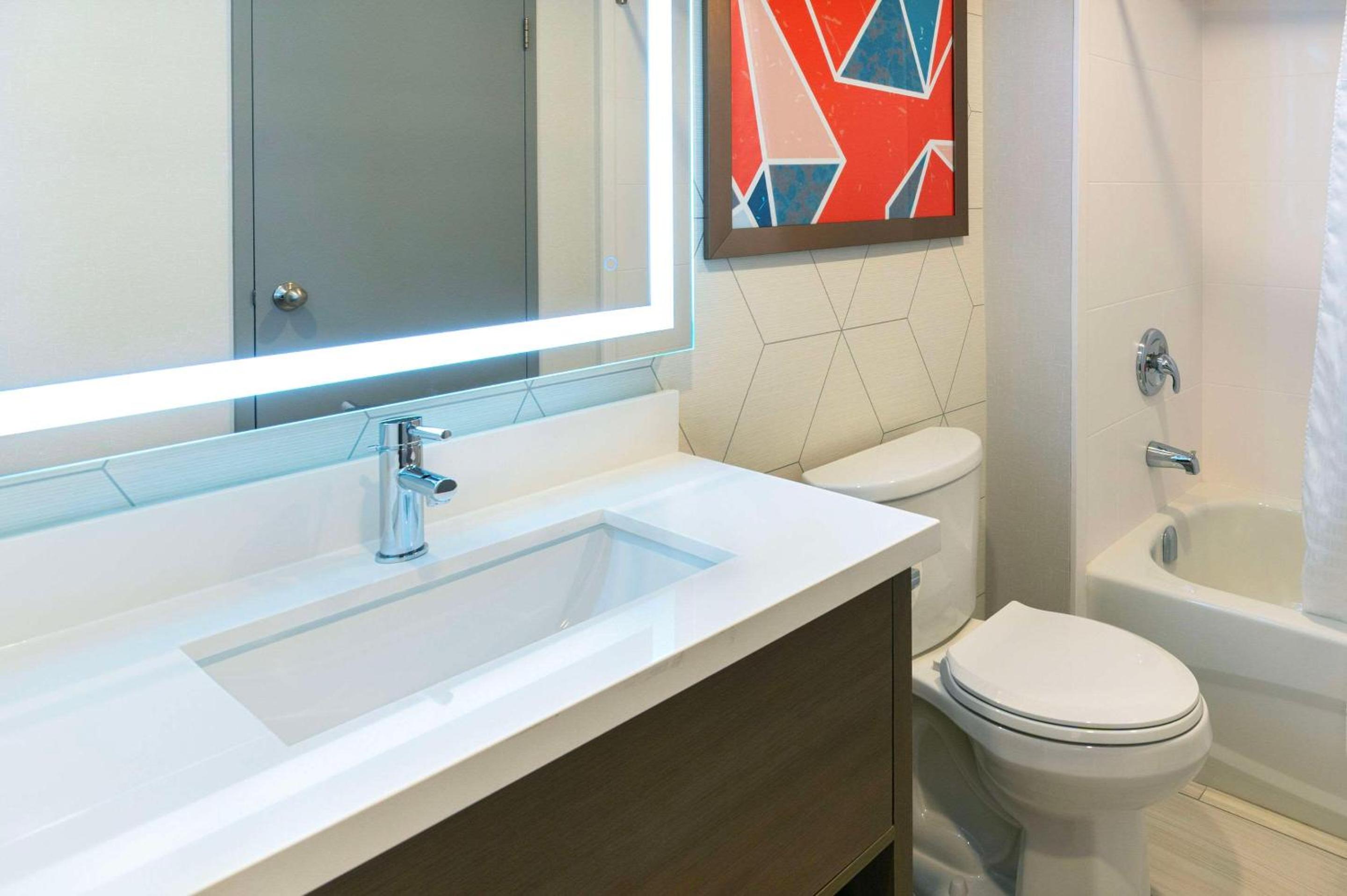bathroom with a sink, toilet, and bathtub