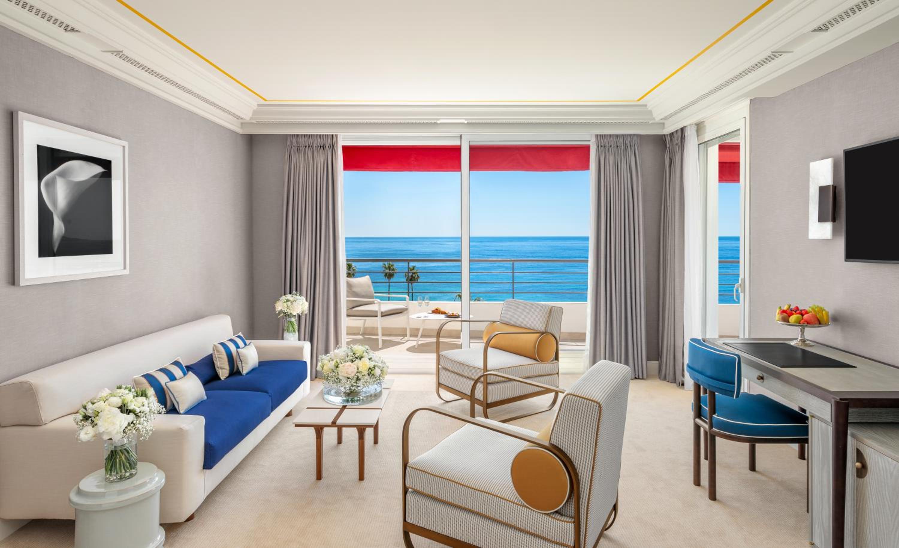 living room with a large window overlooking the ocean?