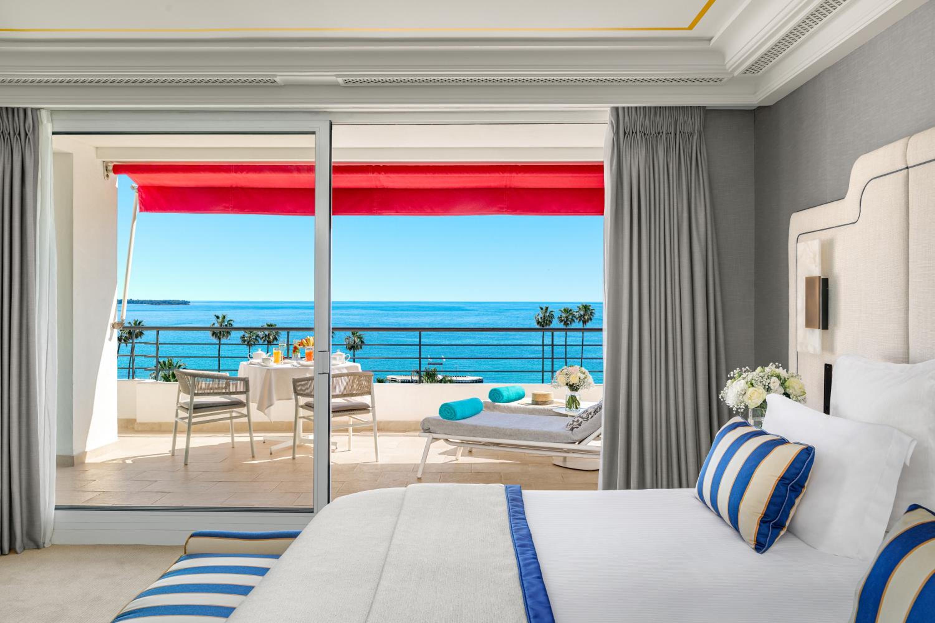 hotel room with a view of the ocean and beach