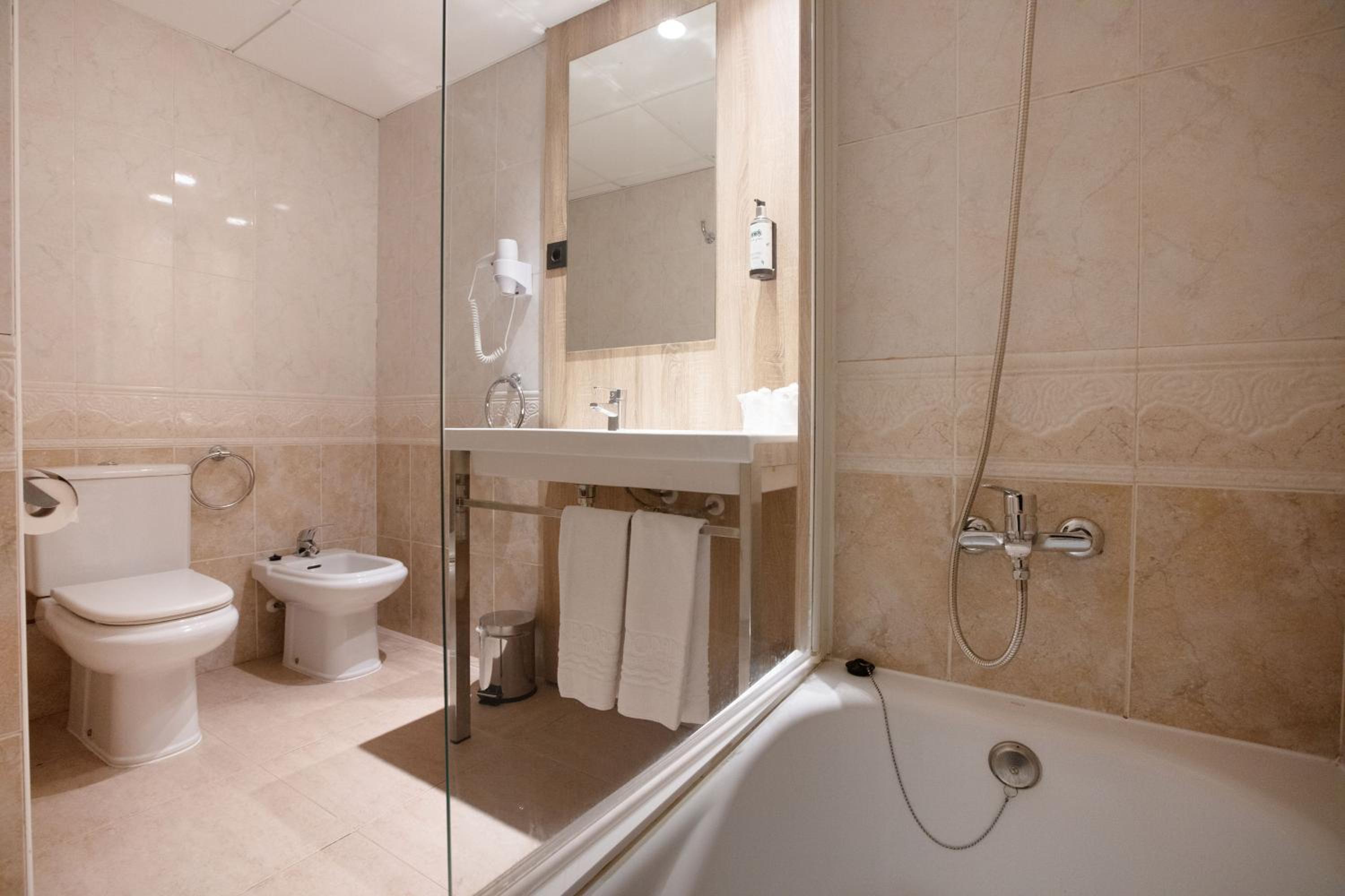 Relax in a modern, elegantly designed bathroom retreat.