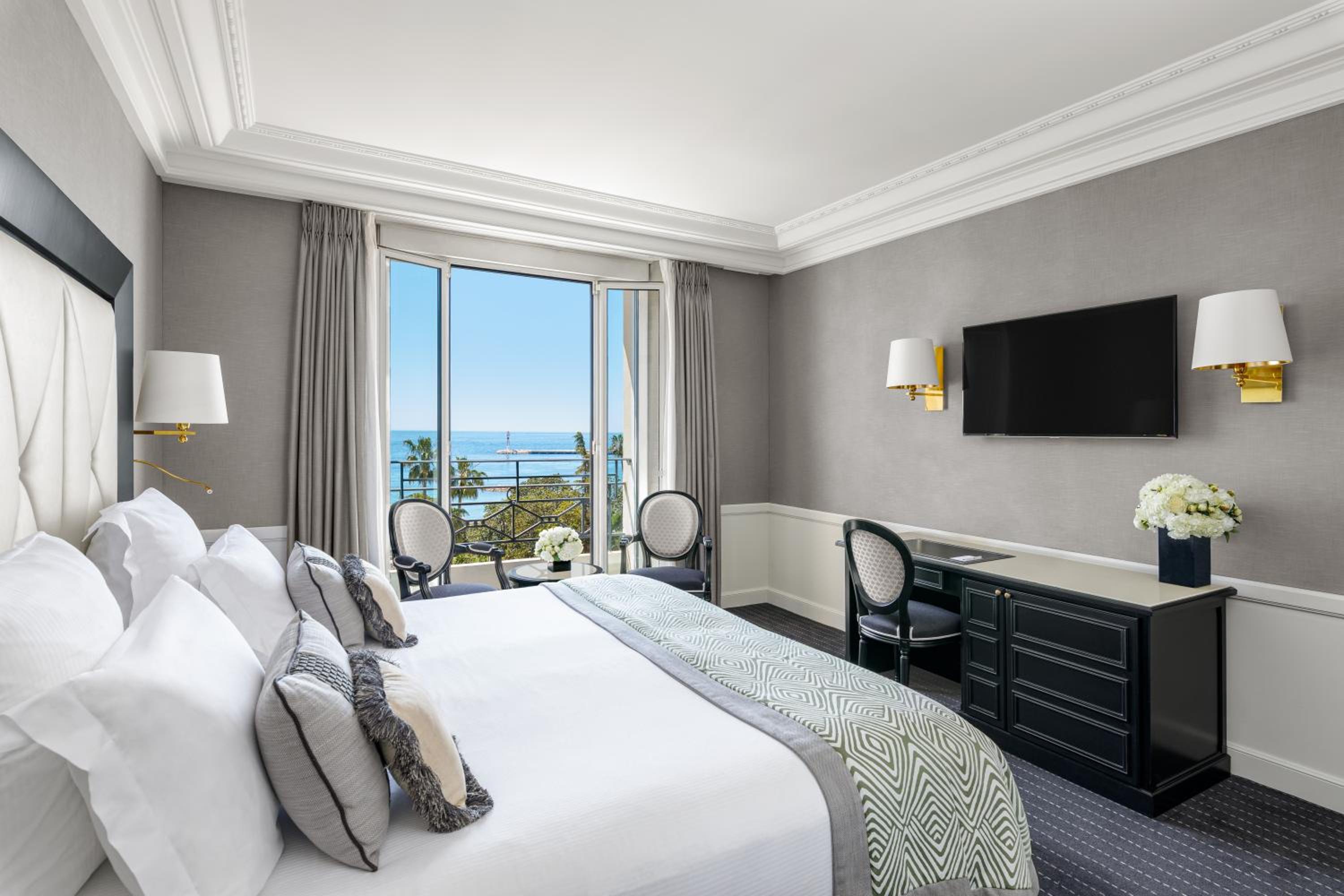 hotel room with a large bed and a flat screen tv