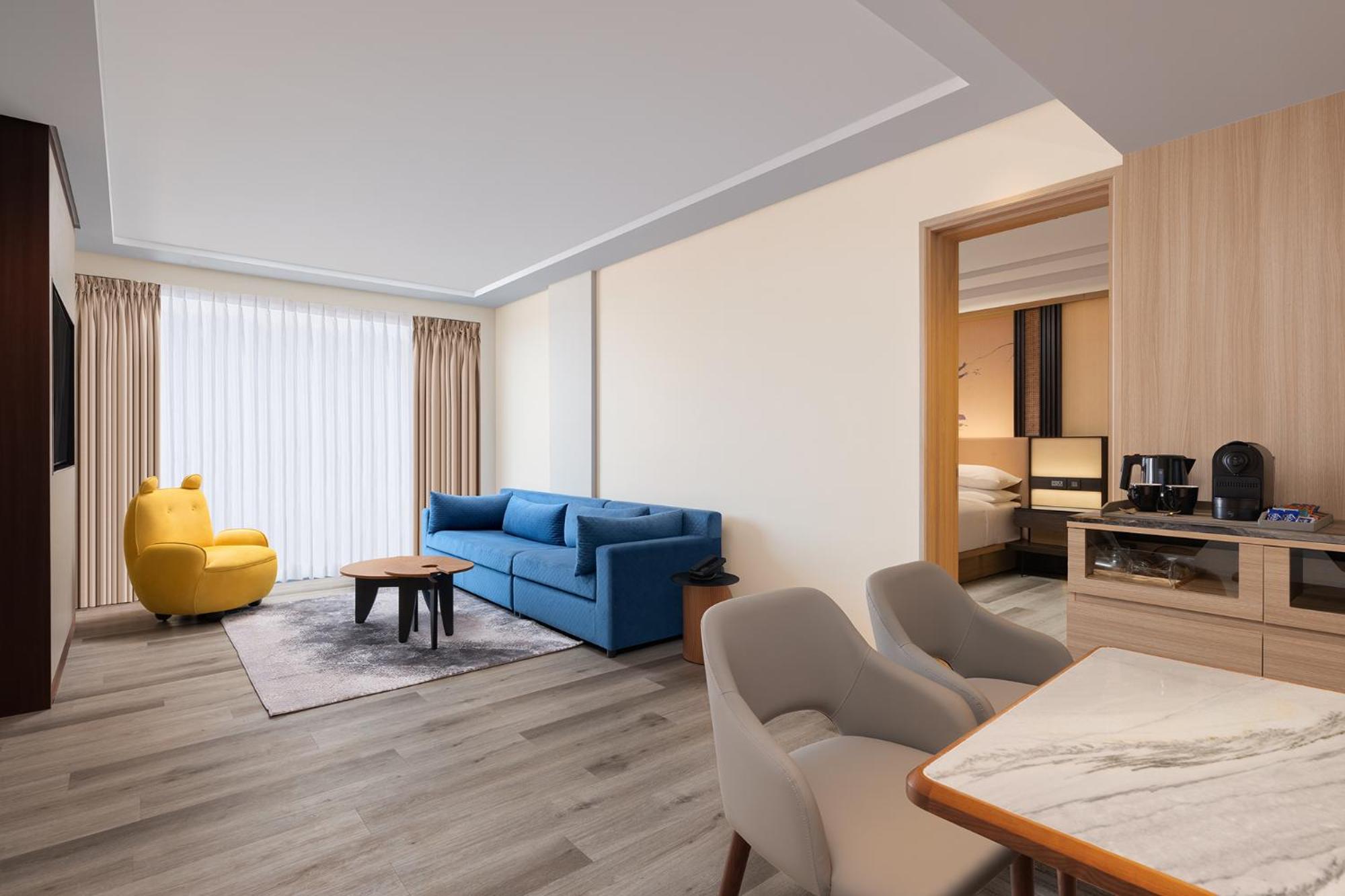Courtyard, Suite, 1 King, Partial pool view, Balcony with INR 500 Spa credit on min therapy of 60 mins per stay - Photo 1