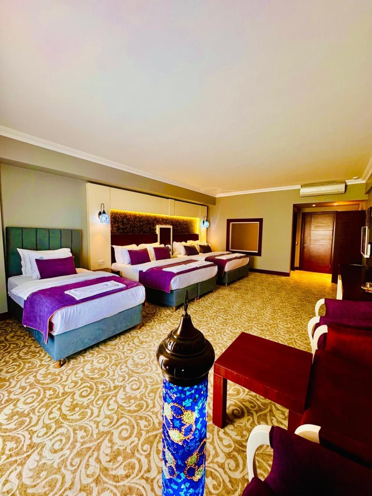 Deluxe Quadruple Room - Photo 7