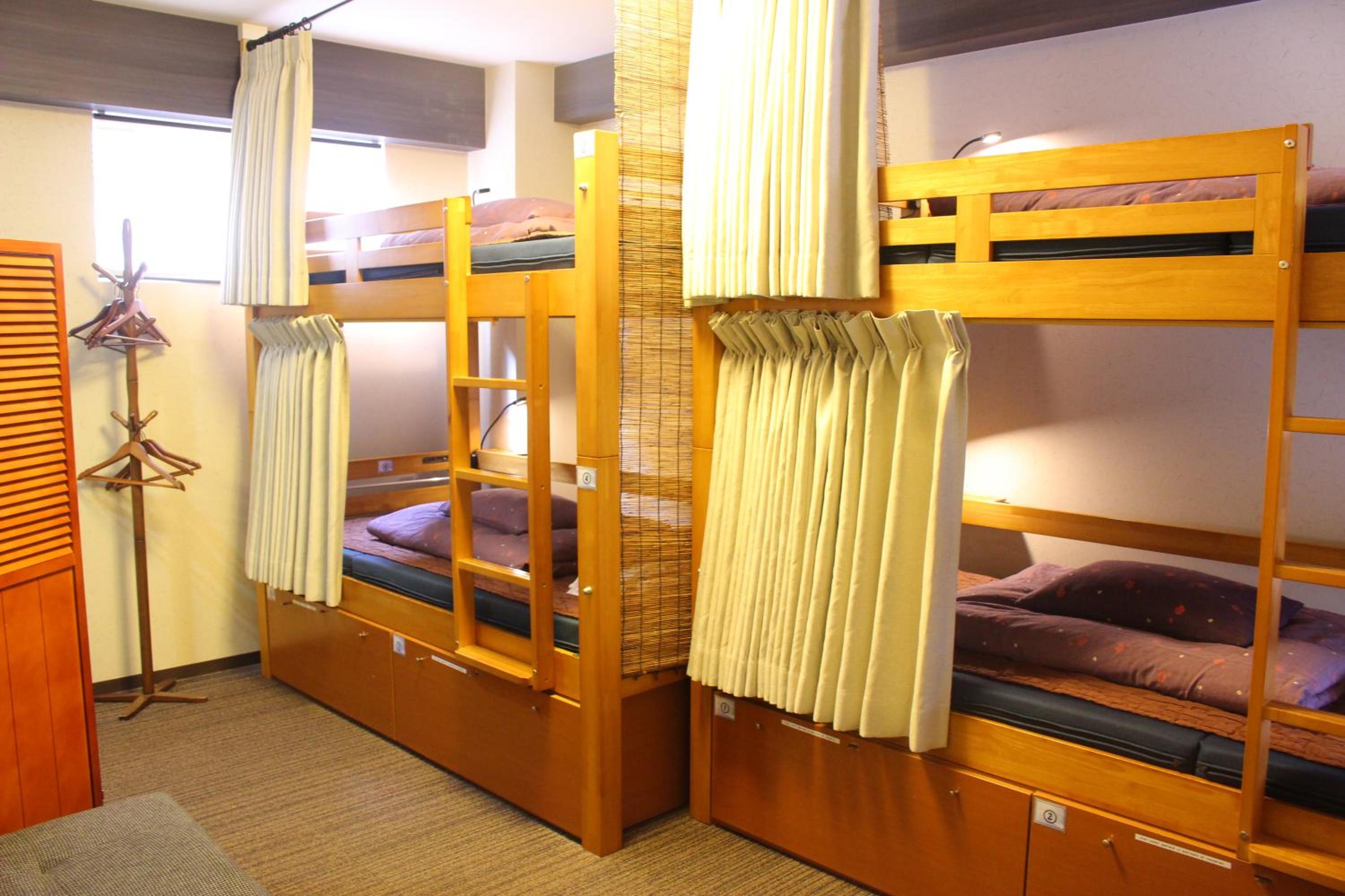 Bunk Bed in 4-Bed Mixed Dormitory Room with Curtain photo 1