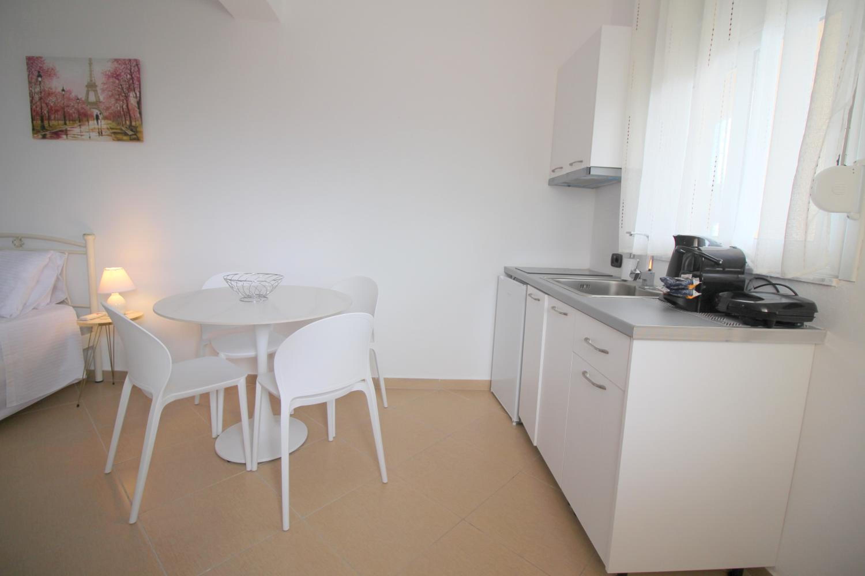 Quadruple Studio with Balcony and Side Sea View