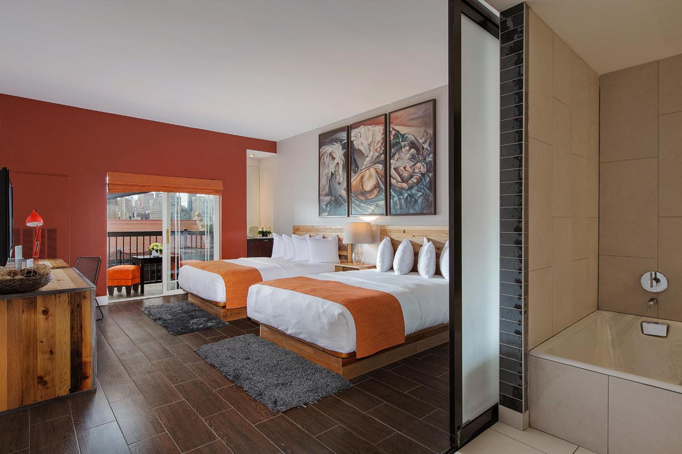Deluxe Family Room with Two Queen Beds and One Bunk Bed - Photo 1