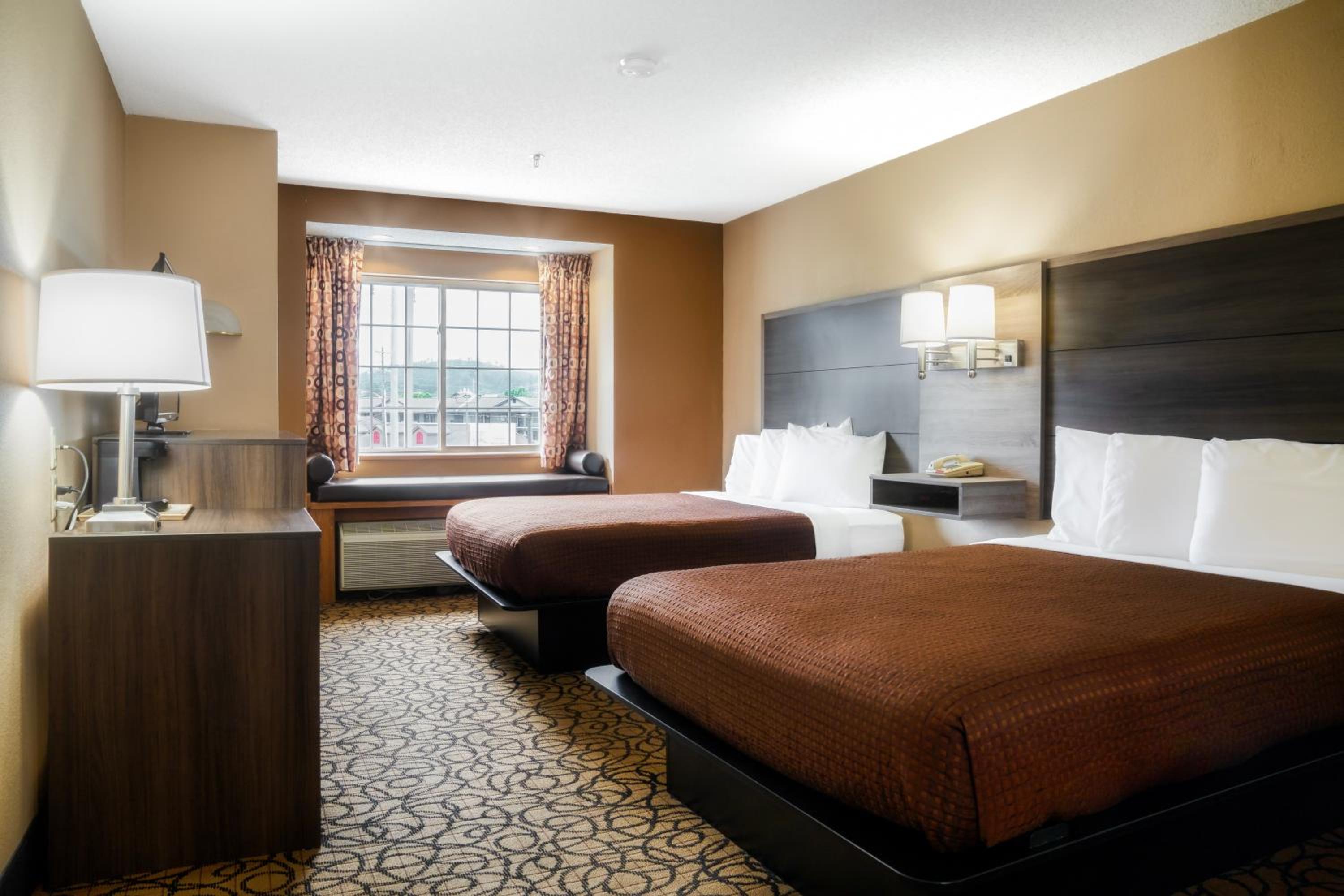 Queen Room with Two Queen Beds - Photo 1