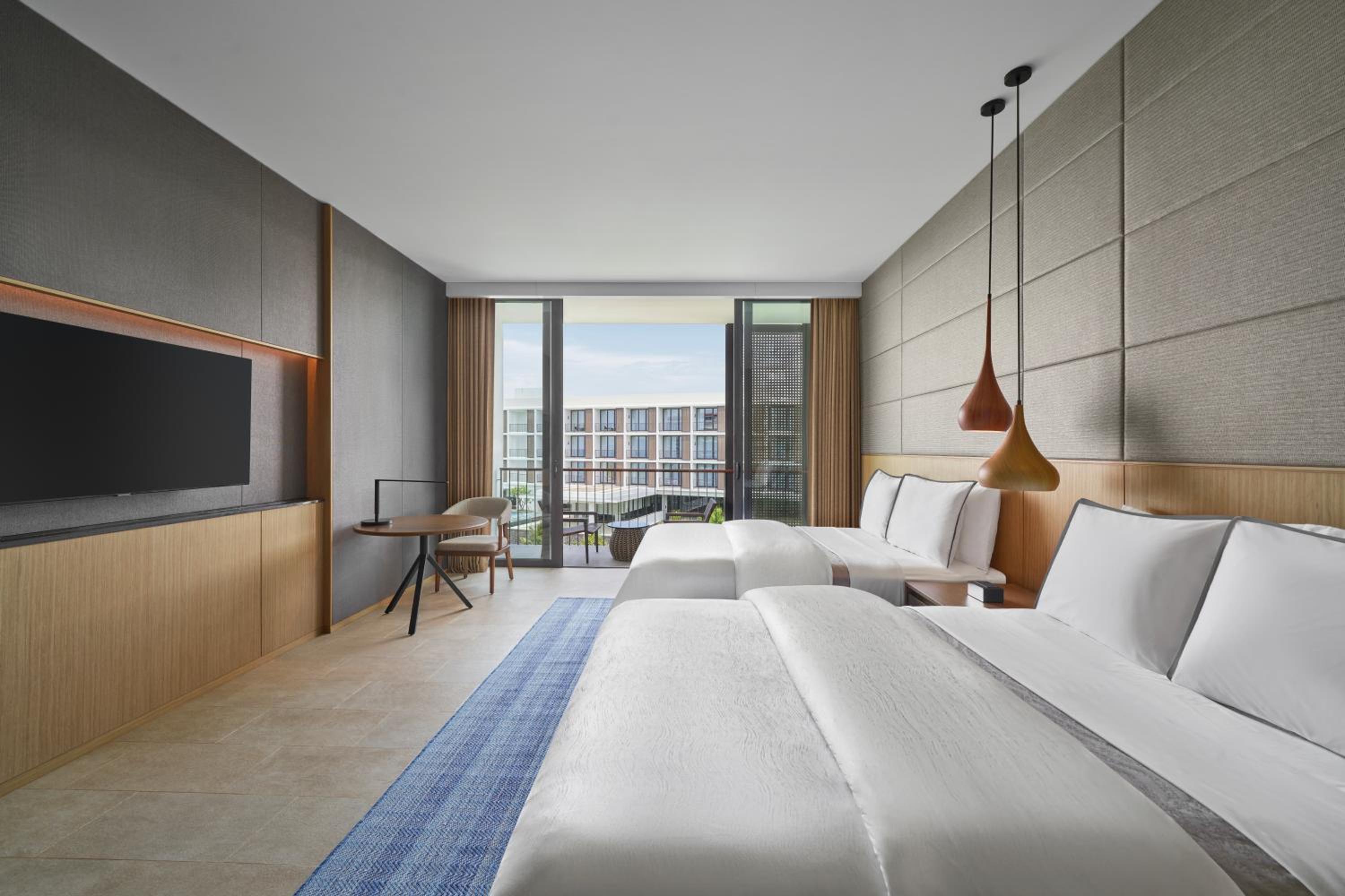 Deluxe Garden view with Two Double Beds and Balcony - Photo 1