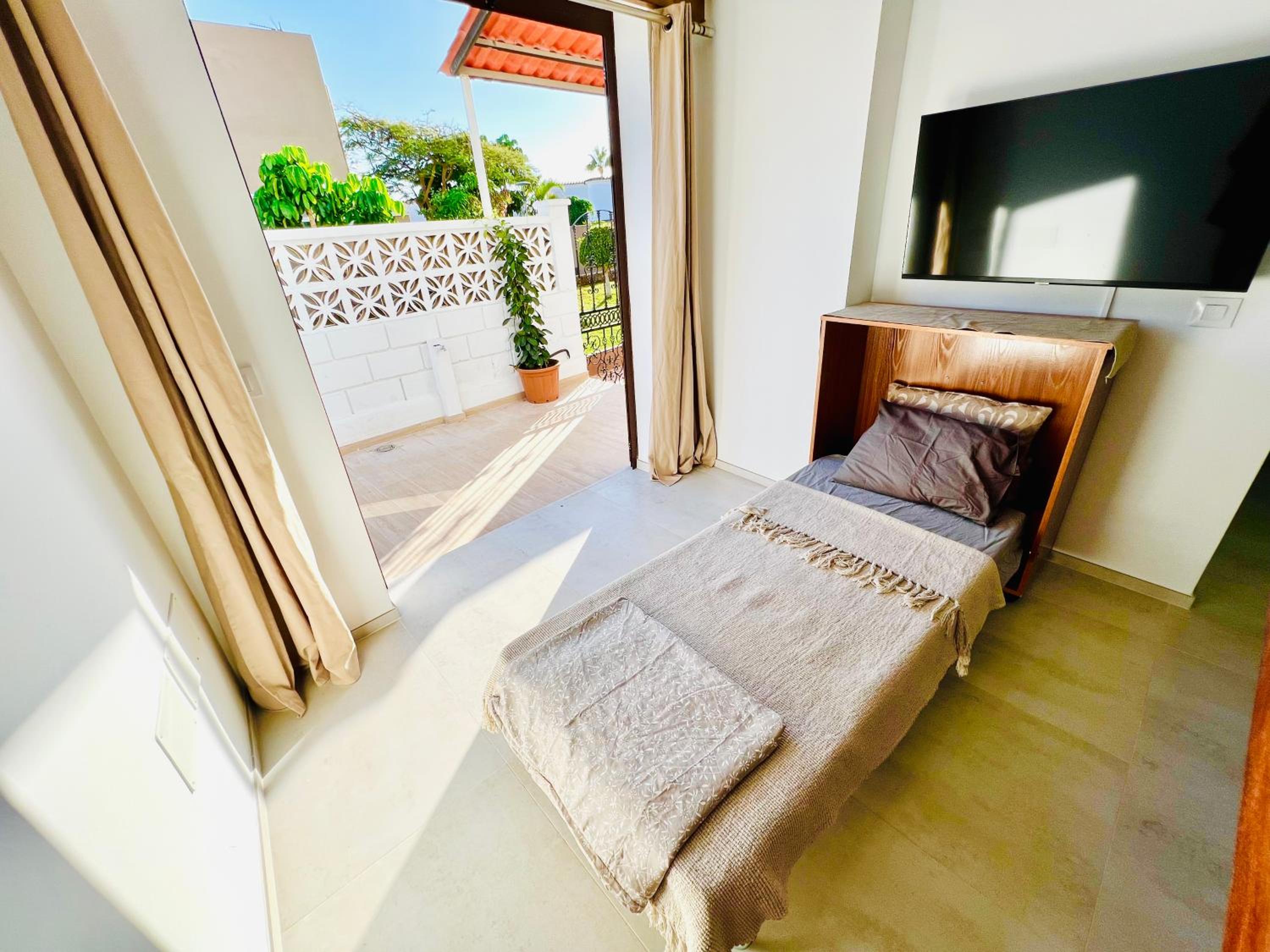 Apartamento de una habitación con vista al jardín