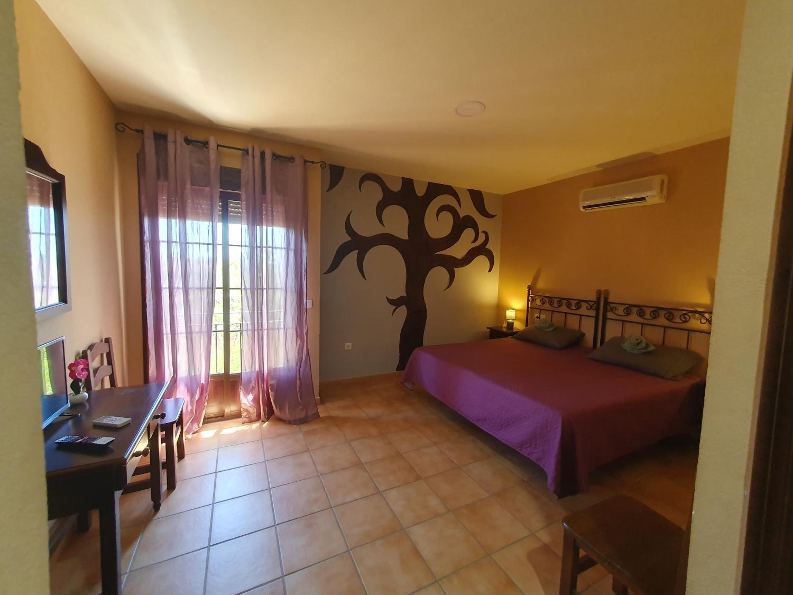 Habitación King con Balcón