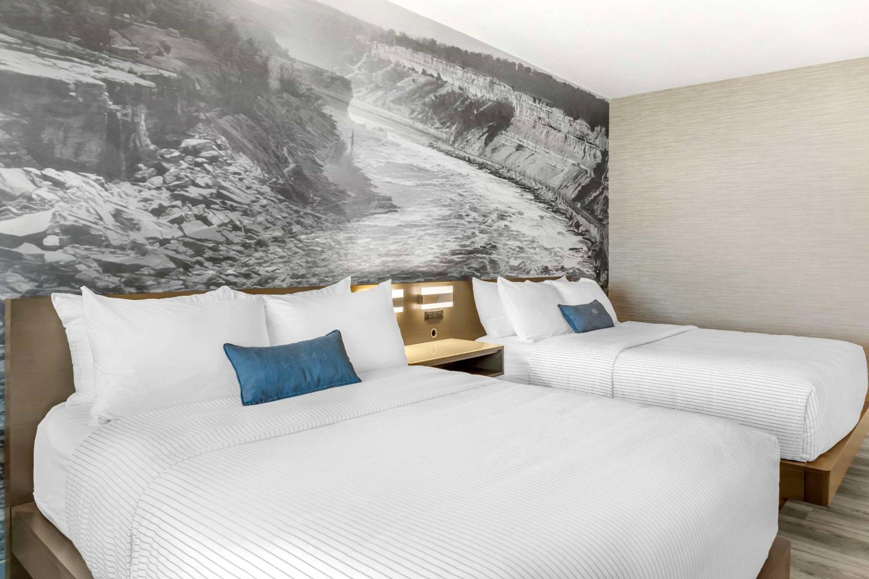 Quadruple Room with Two Queen Beds and Water View - Non Smoking photo 1