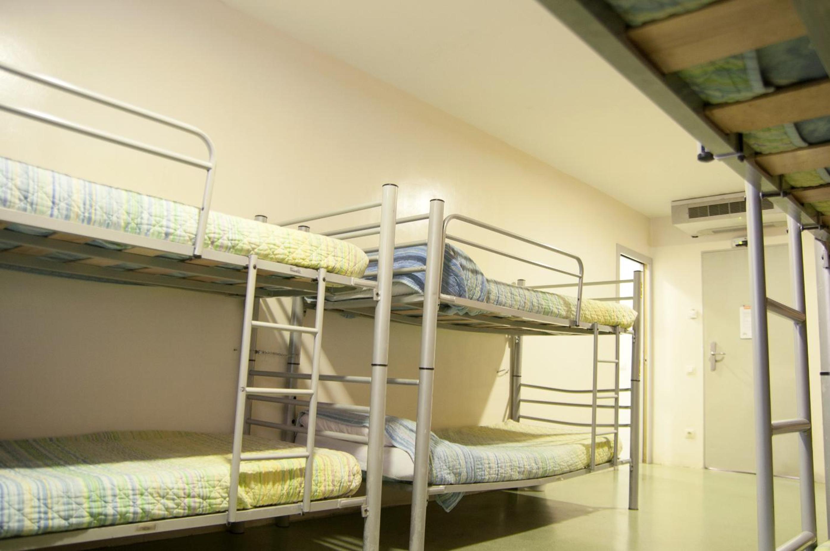 bed in 8-bed dormitory with private bathroom photo 2