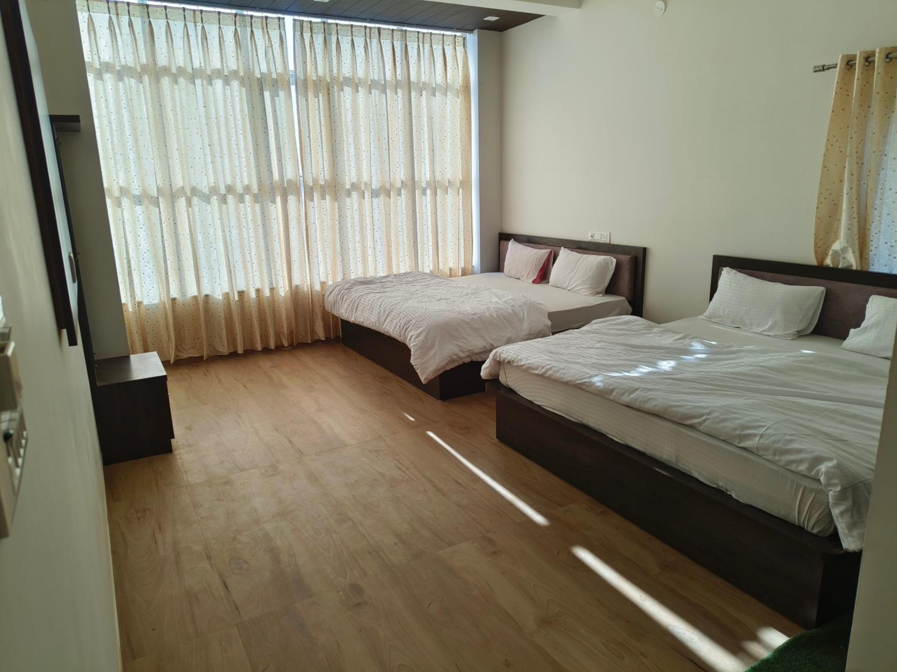 Deluxe Queen Room With Two Queen Beds photo 2
