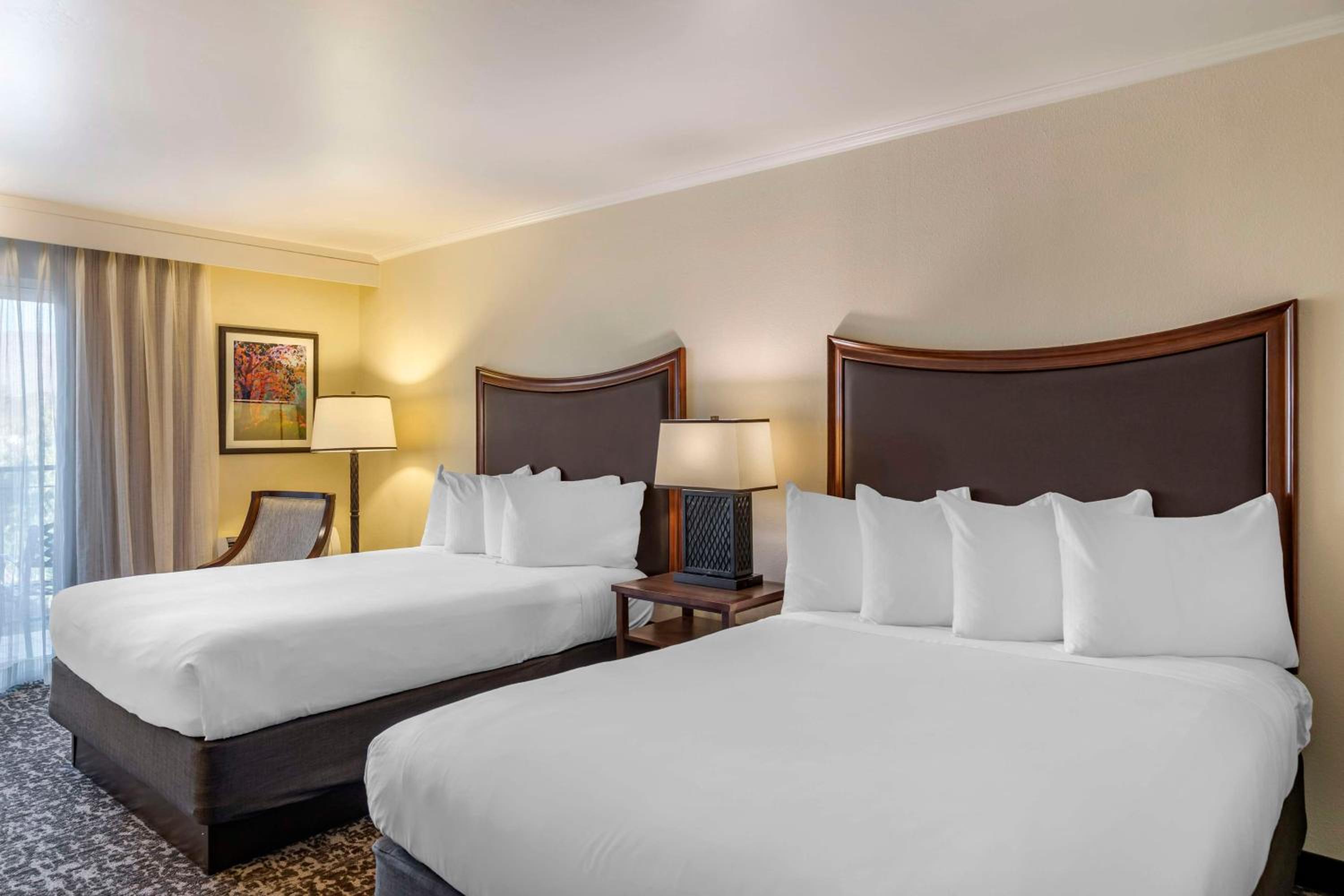 Queen Room with Two Queen Beds with Balcony & Pool View photo 2