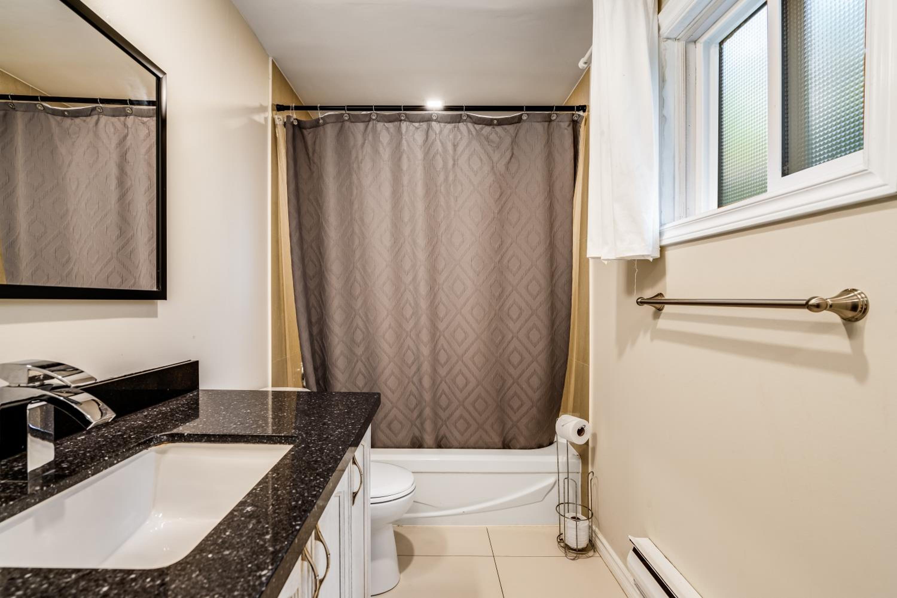 Three-Bedroom House - Photo 25